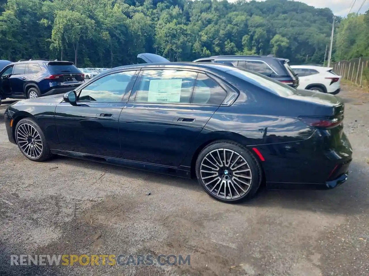 2 Фотография поврежденного автомобиля WBA33EJ03TCX86053 BMW 7 SERIES 2026