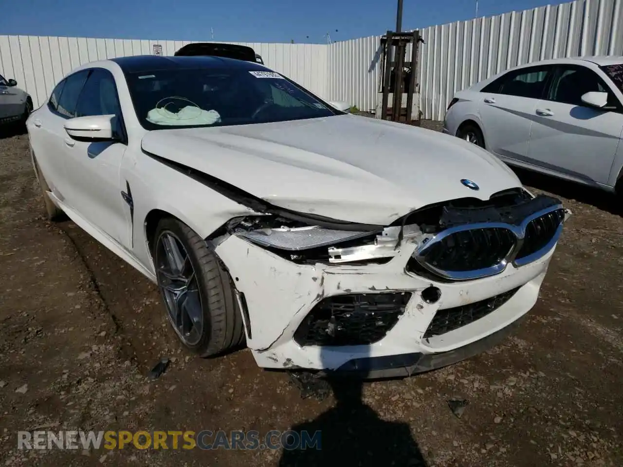 1 Photograph of a damaged car WBSGV0C07LCD74812 BMW M8 2020