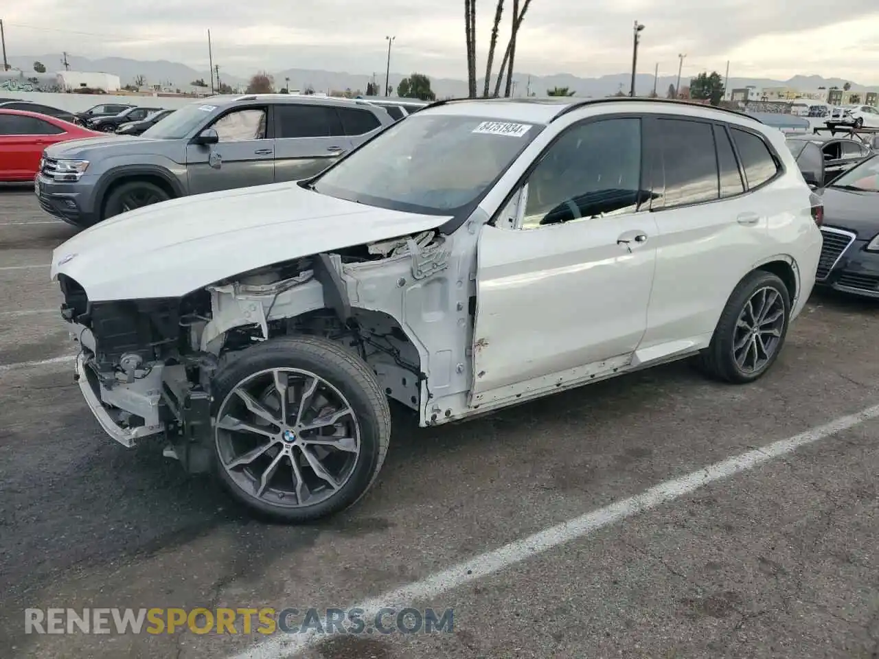 1 Photograph of a damaged car 5UX43DP0XN9J98710 BMW X3 2022