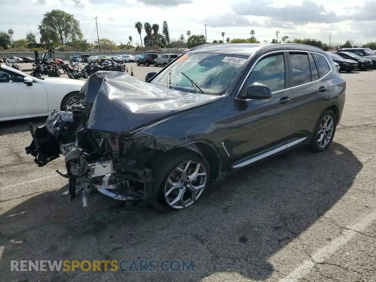 1 Photograph of a damaged car 5UX43DP01P9R40785 BMW X3 2023