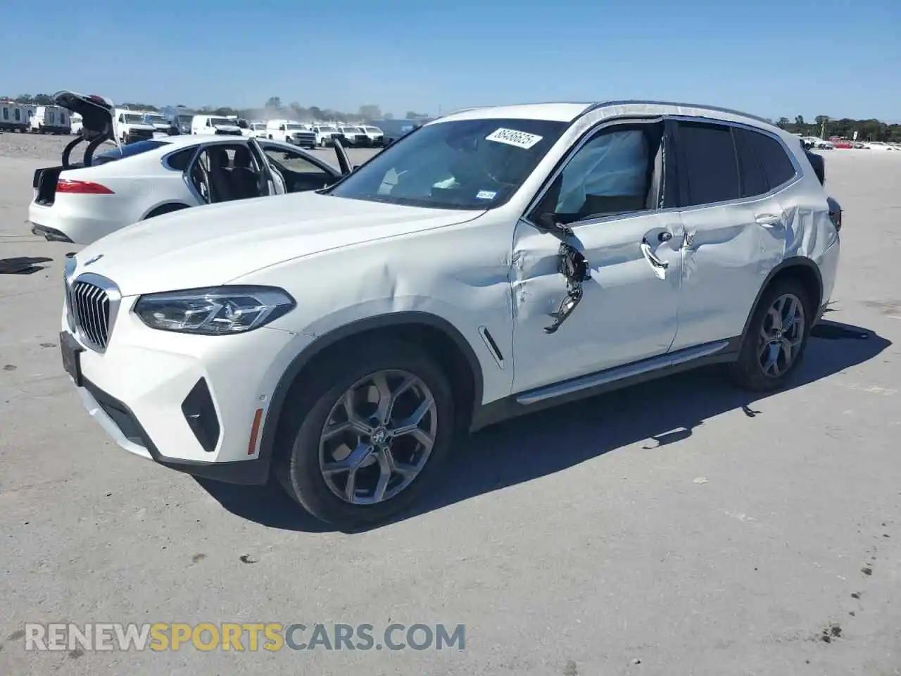 1 Photograph of a damaged car 5UX43DP04P9N79875 BMW X3 2023