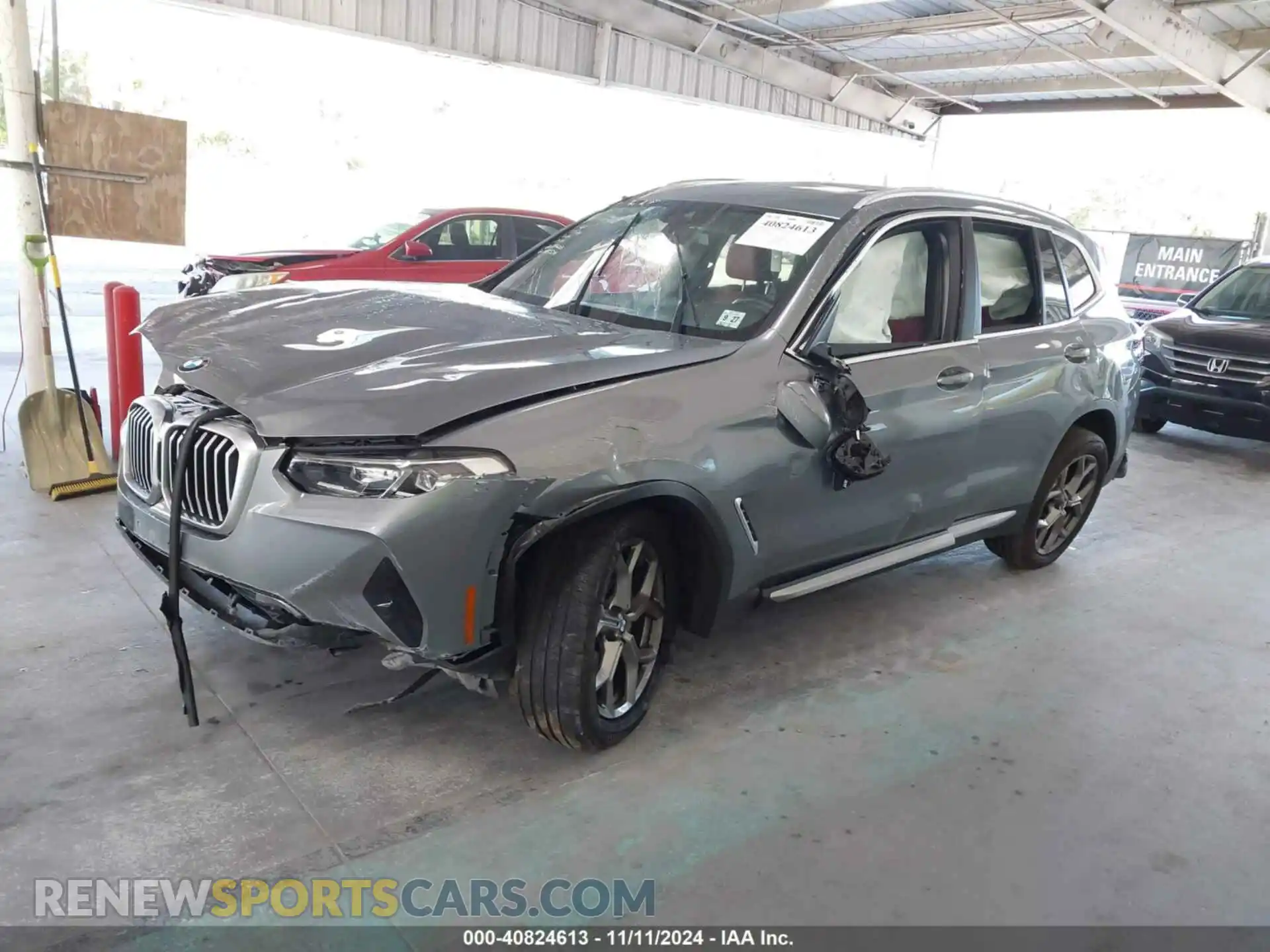 2 Photograph of a damaged car 5UX53DP04P9N70744 BMW X3 2023