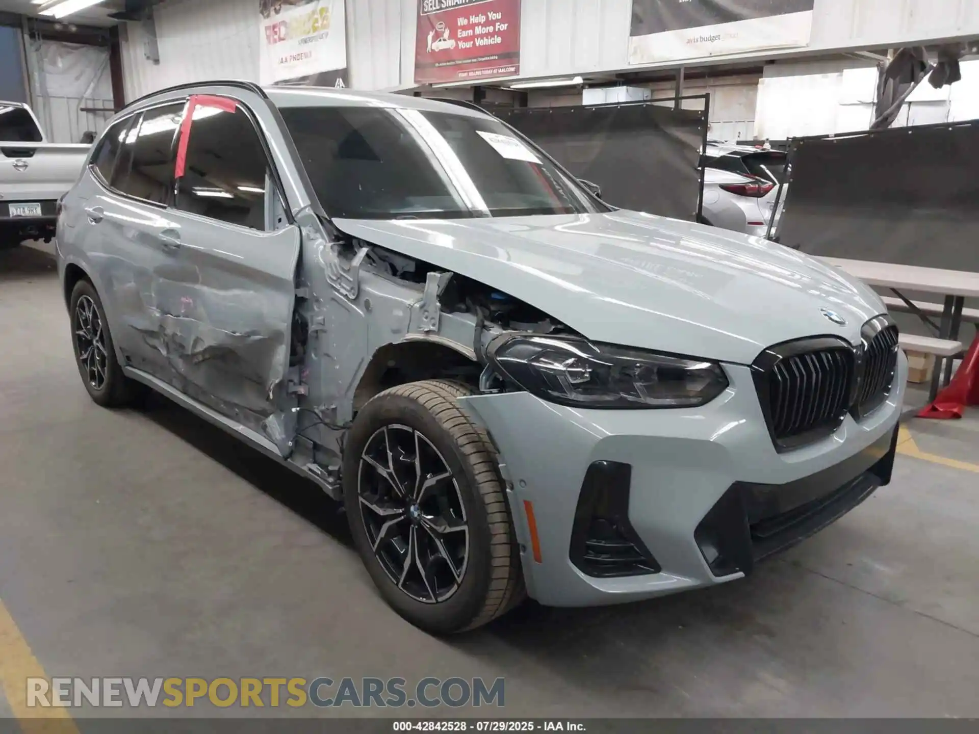 1 Photograph of a damaged car 5UX83DP07R9U95683 BMW X3 2024