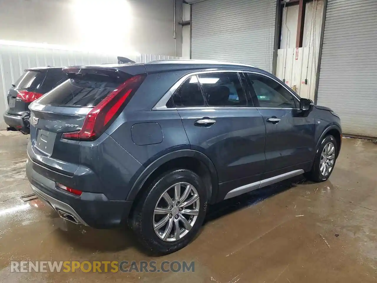 3 Photograph of a damaged car 1GYFZCR40MF034928 CADILLAC XT4 2021