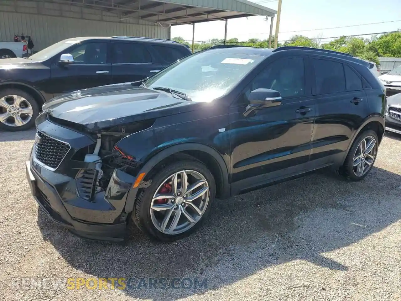 1 Photograph of a damaged car 1GYFZER44MF015908 CADILLAC XT4 2021