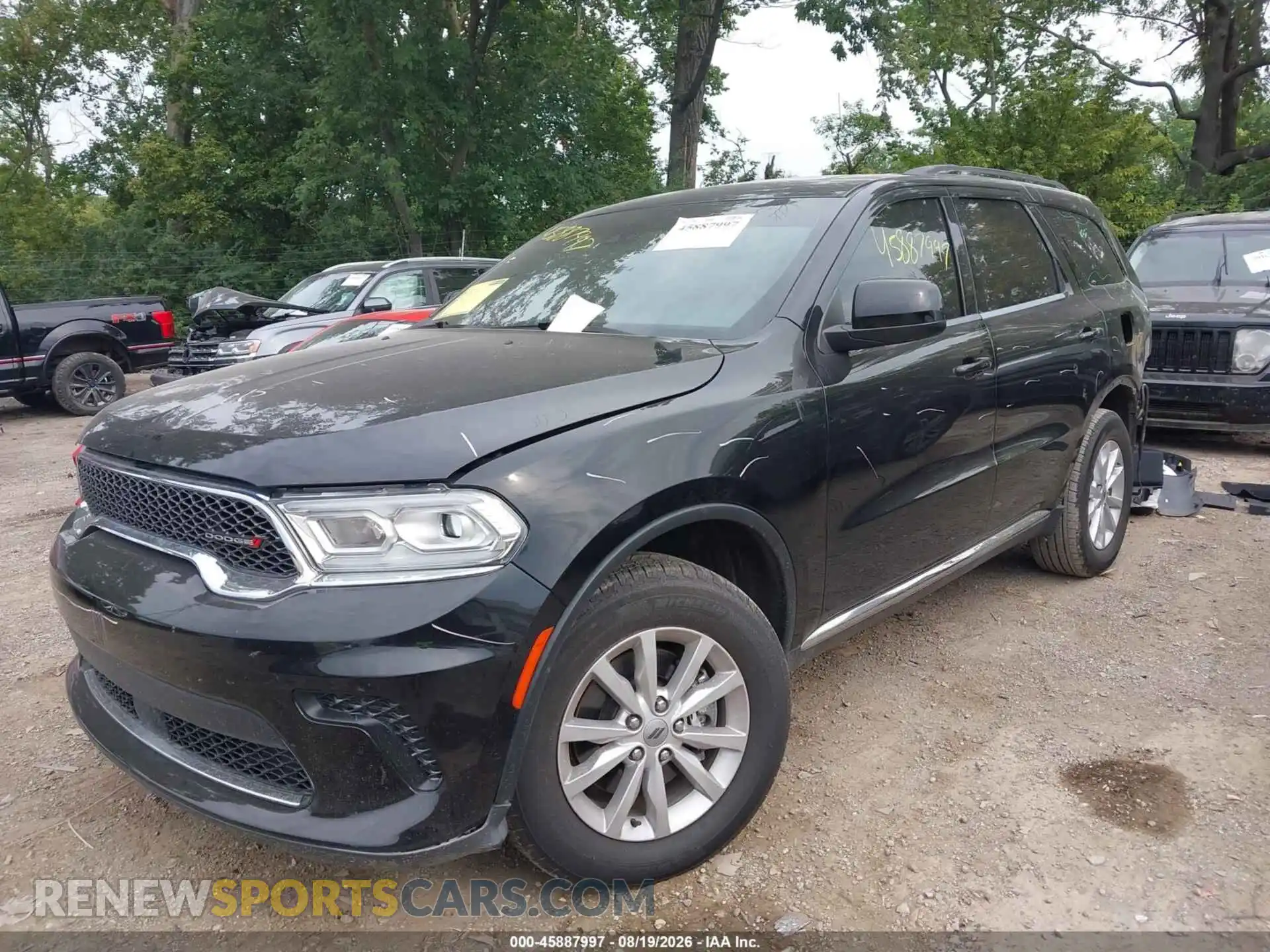 2 fotografías del automóvil dañado 1C4RDJAG1PC611595 DODGE DURANGO 2023