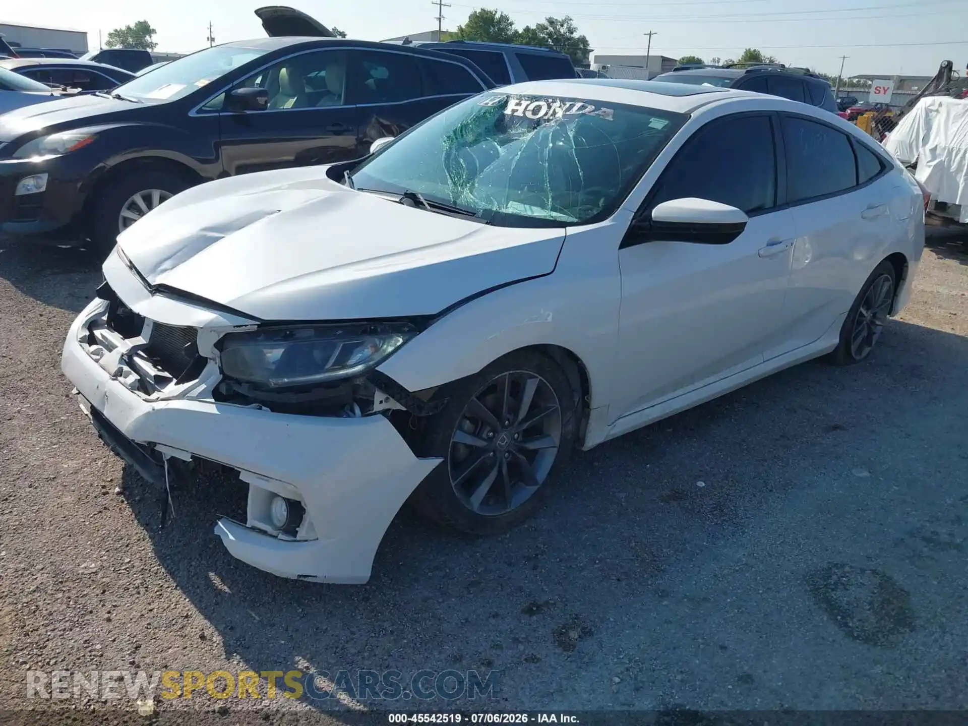 2 fotografías del automóvil dañado 19XFC1F74ME004013 HONDA CIVIC 2021