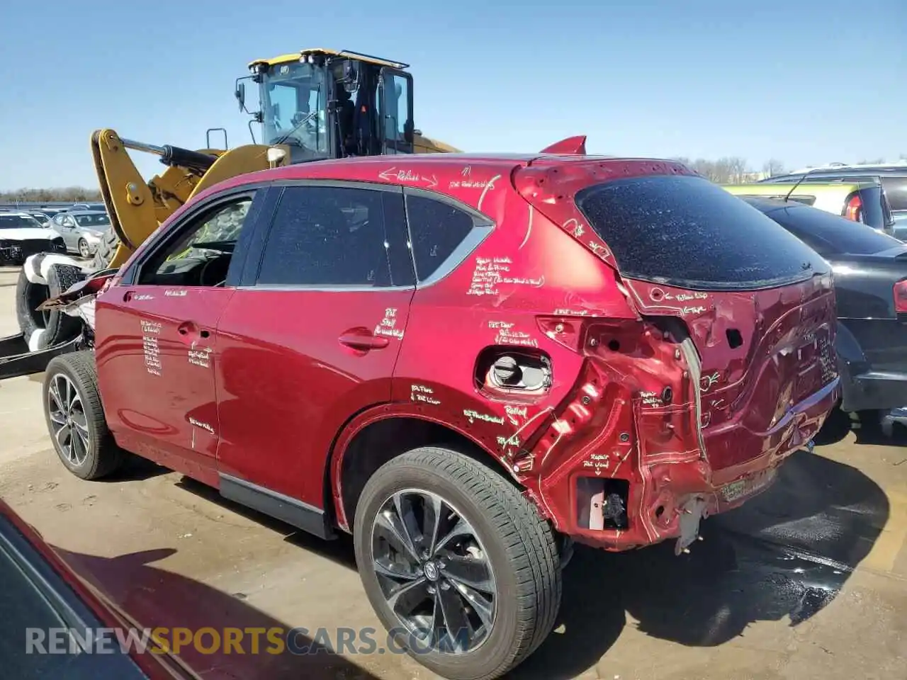 2 fotografías del automóvil dañado JM3KFBEM9P0131265 MAZDA CX-5 PREMI 2023