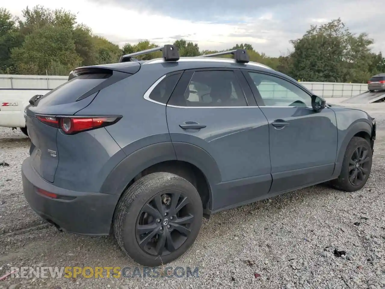 3 Photograph of a damaged car 3MVDMBDY3NM405581 MAZDA CX30 2022