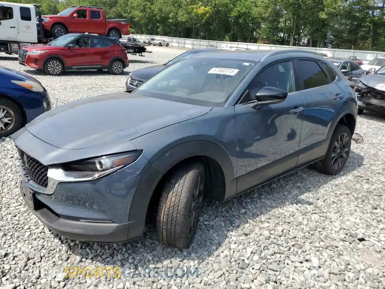1 Photograph of a damaged car 3MVDMBCM9PM557642 MAZDA CX30 2023
