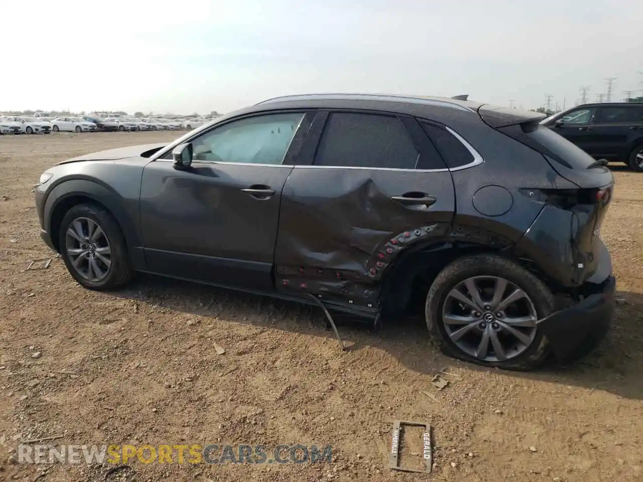 2 fotografías del automóvil dañado 3MVDMBDM0RM721443 MAZDA CX30 2024