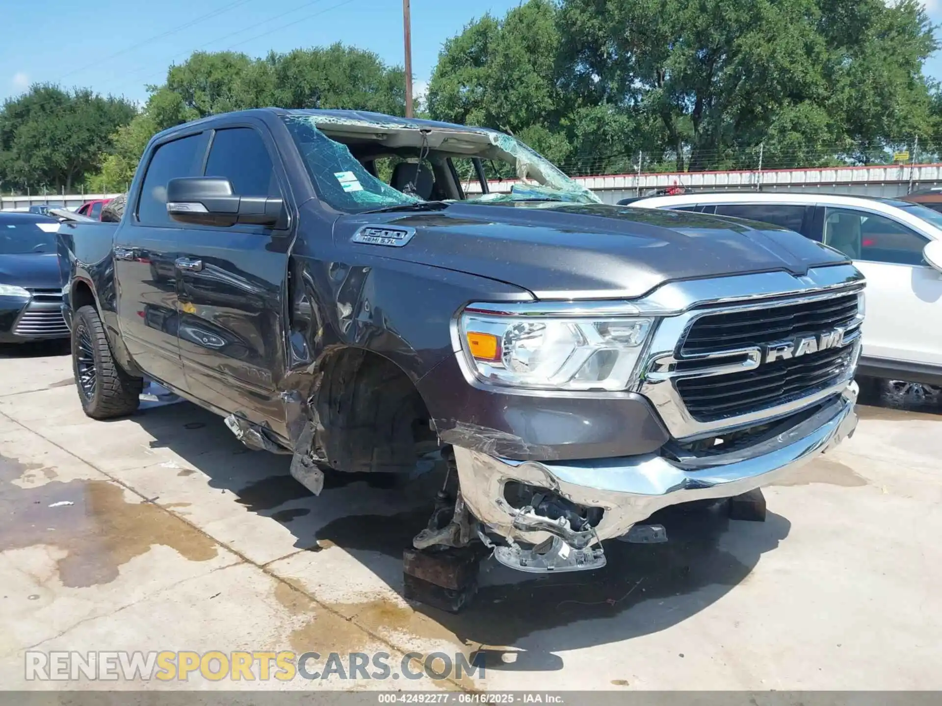 1 Photograph of a damaged car 1C6RREFT8KN567890 RAM 1500 2019