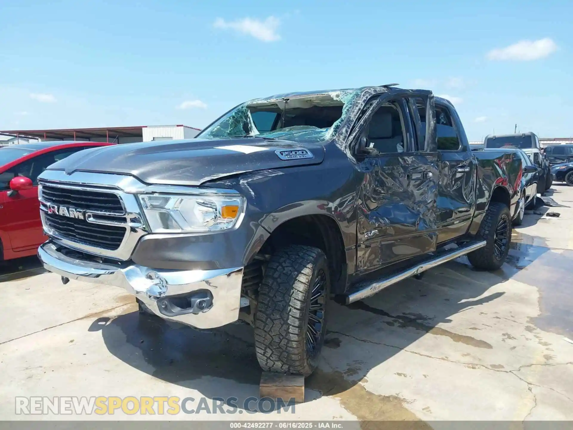 2 Photograph of a damaged car 1C6RREFT8KN567890 RAM 1500 2019