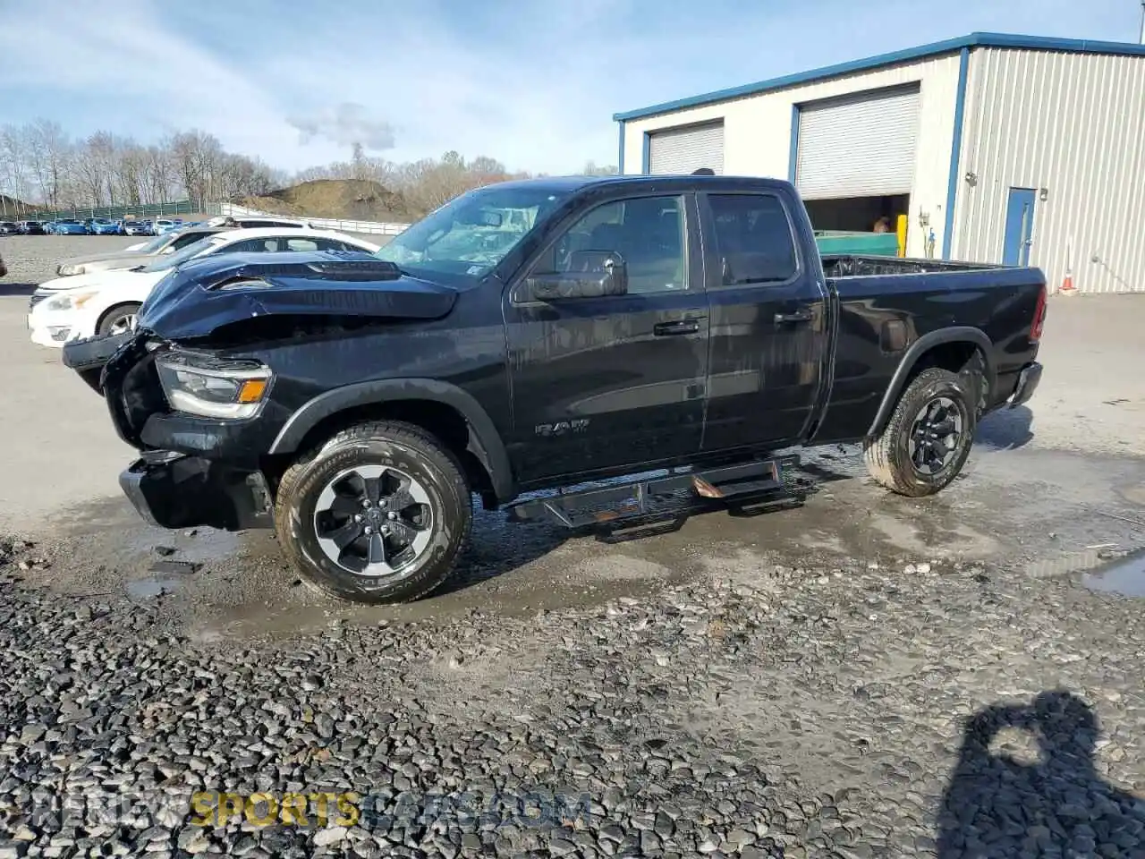1 Photograph of a damaged car 1C6SRFET5KN580766 RAM 1500 2019