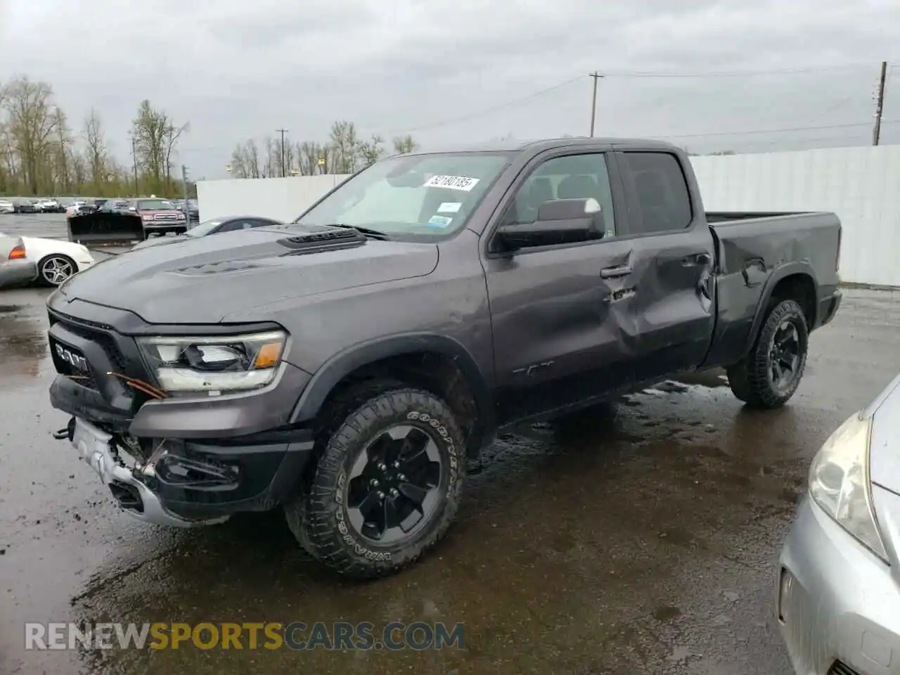 1 Photograph of a damaged car 1C6SRFET9KN717269 RAM 1500 2019