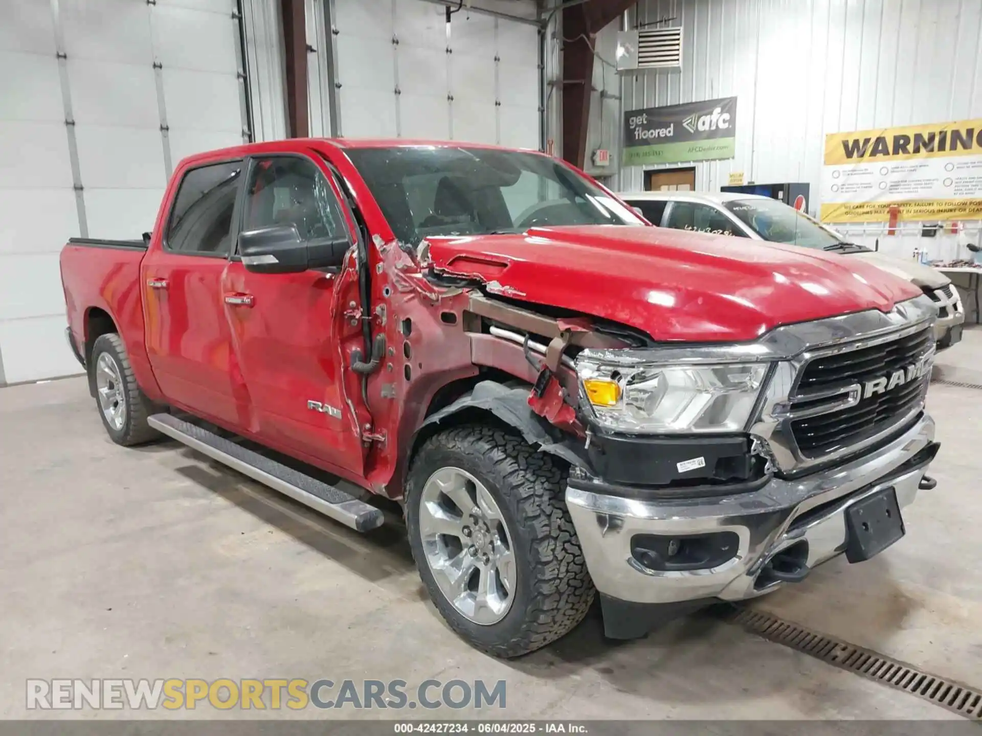 1 Photograph of a damaged car 1C6SRFFT5KN780013 RAM 1500 2019