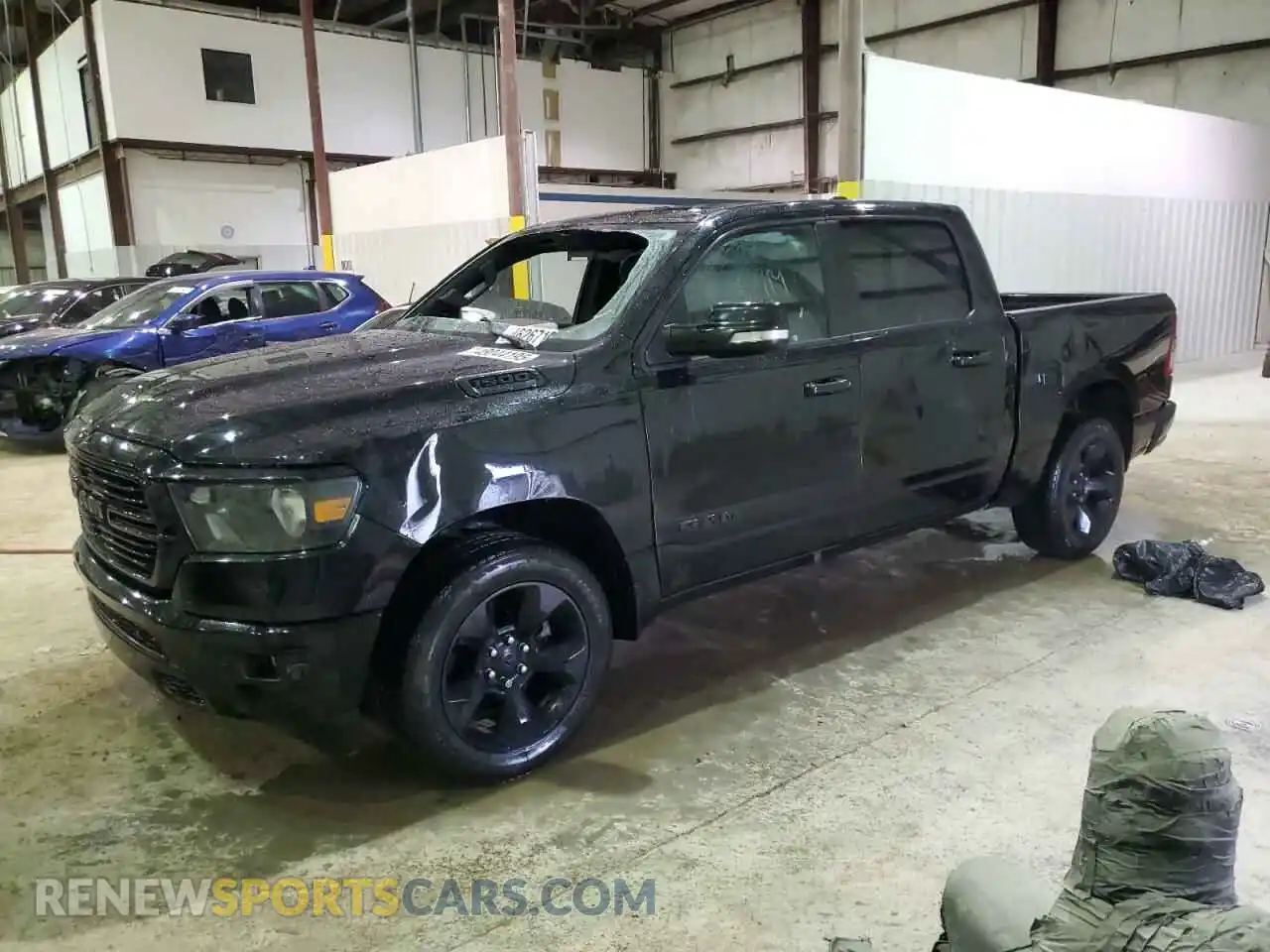 1 Photograph of a damaged car 1C6SRFFT5KN850741 RAM 1500 2019