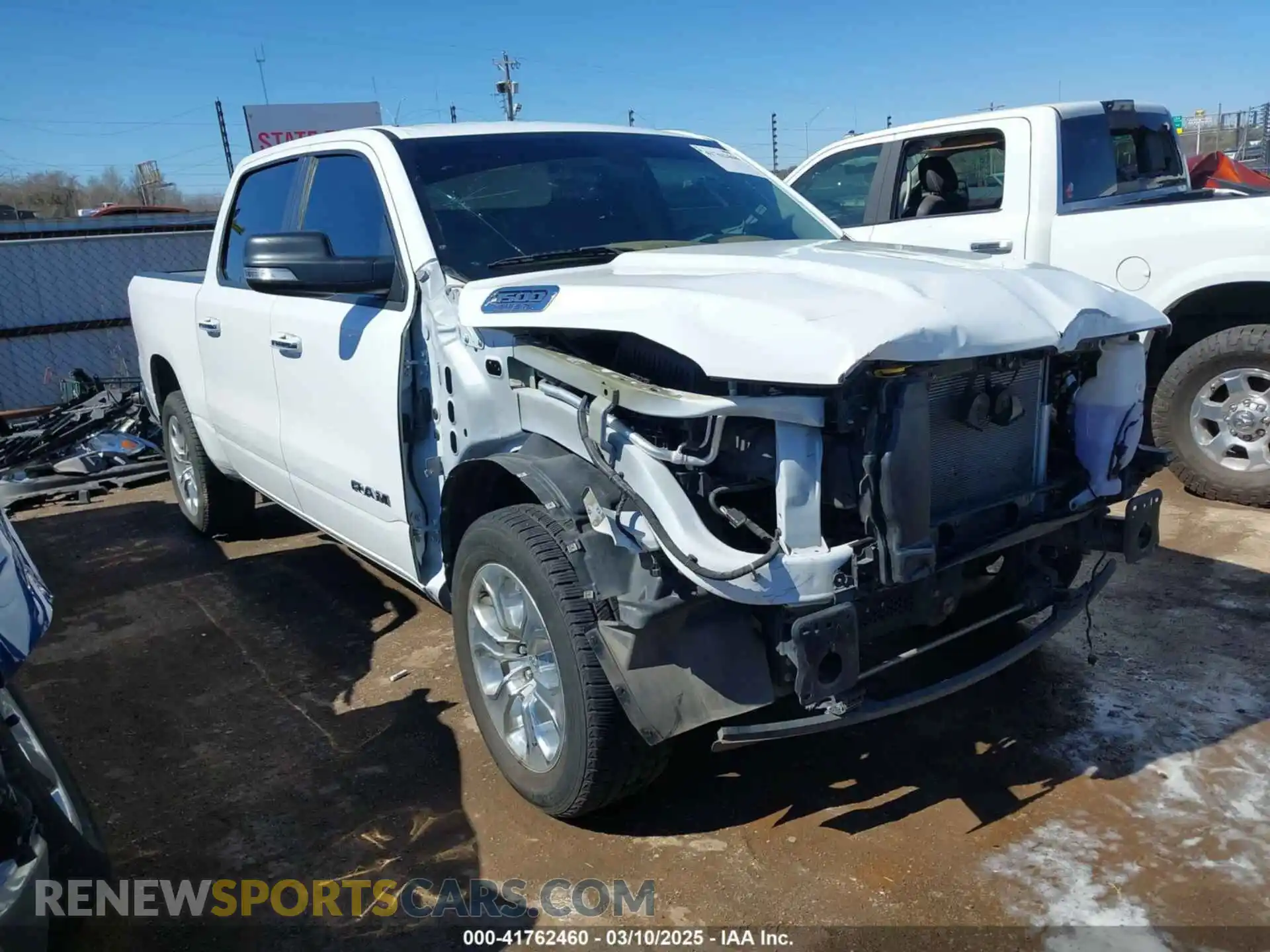 1 Photograph of a damaged car 1C6RREFT0LN311731 RAM 1500 2020