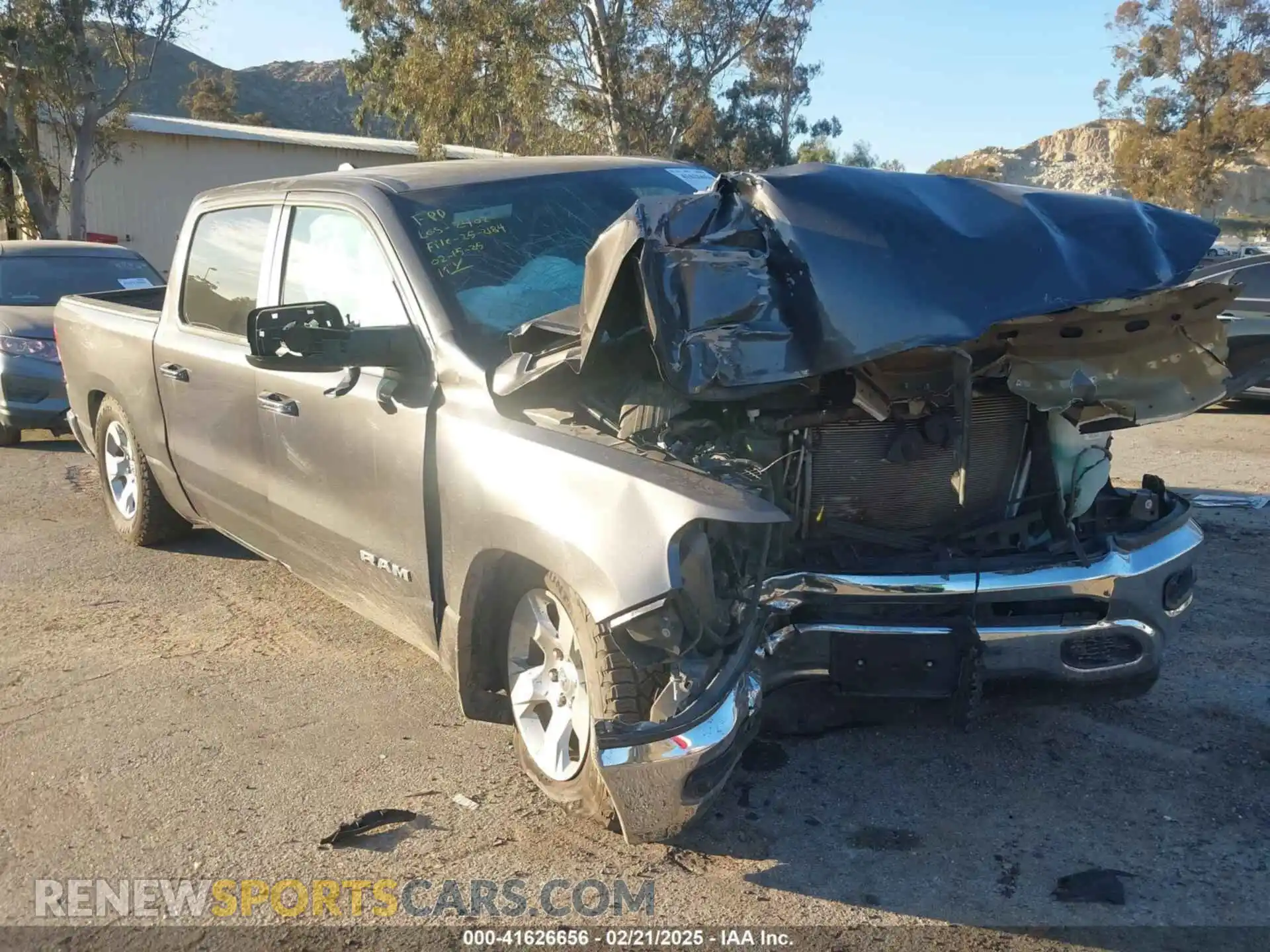 1 Photograph of a damaged car 1C6RREFT4LN372628 RAM 1500 2020