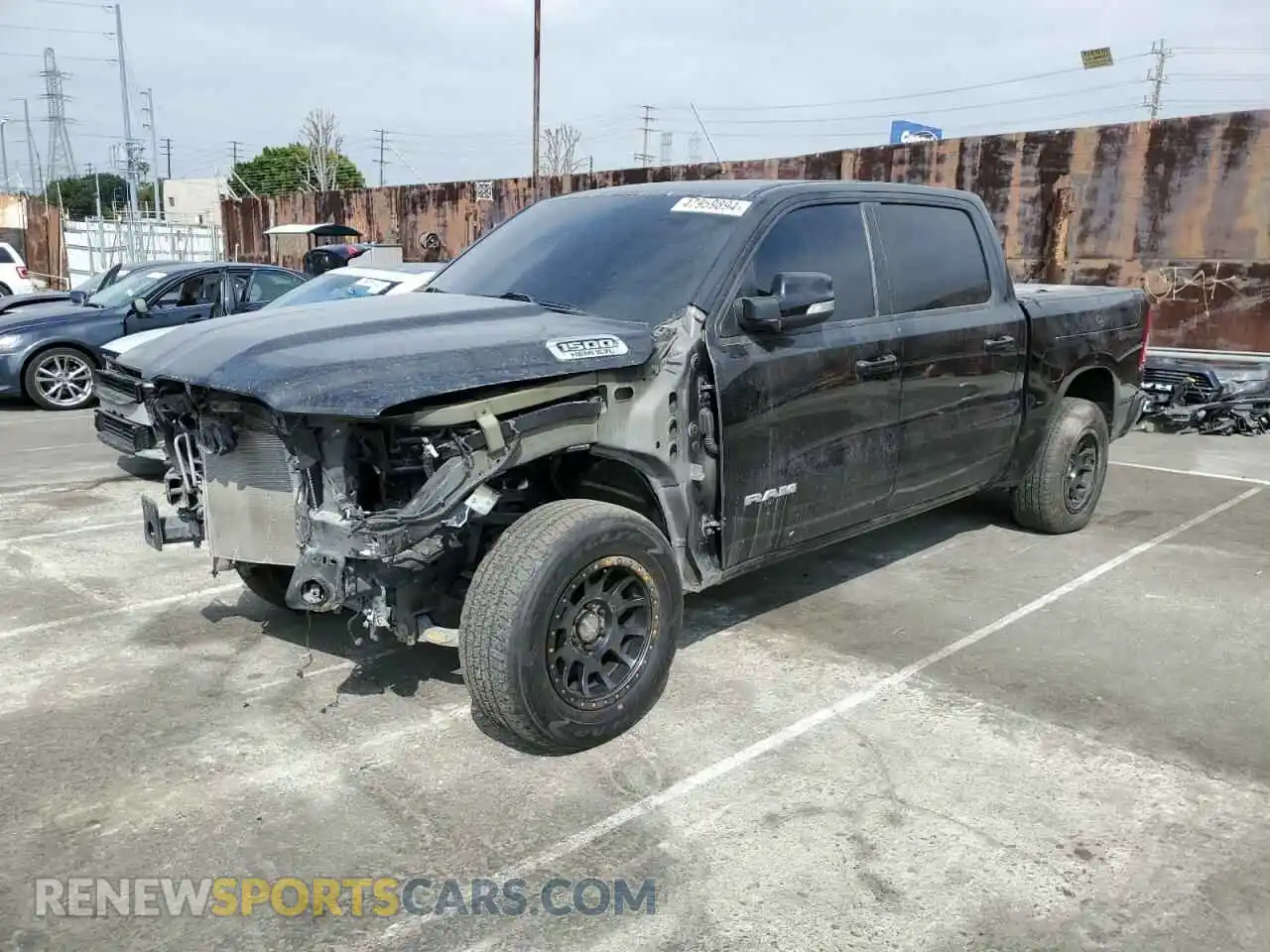 1 Photograph of a damaged car 1C6RREFT6LN152424 RAM 1500 2020