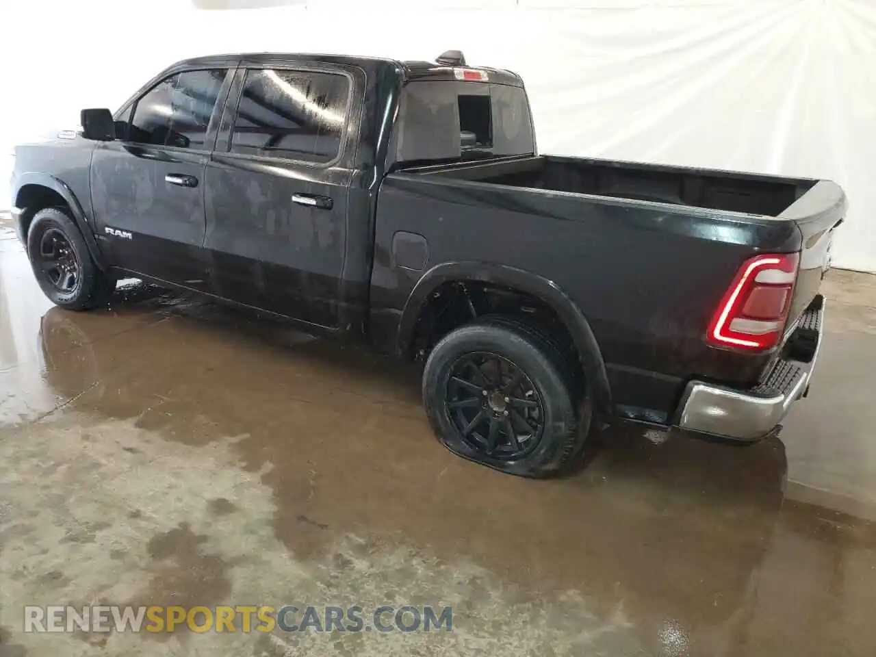2 Photograph of a damaged car 1C6RREJT0LN238318 RAM 1500 2020