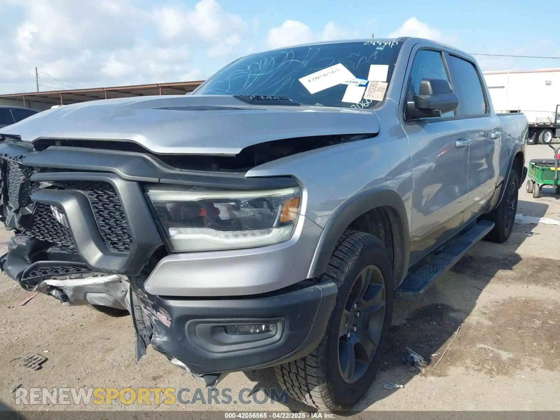 2 Photograph of a damaged car 1C6RRELT4LN267060 RAM 1500 2020