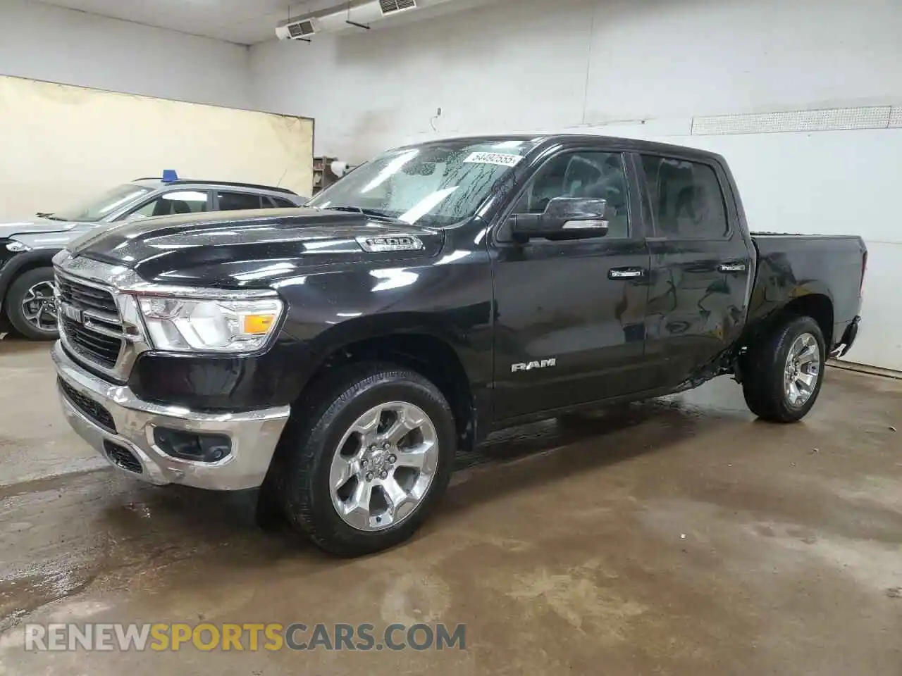 1 Photograph of a damaged car 1C6SRFFT6LN327102 RAM 1500 2020