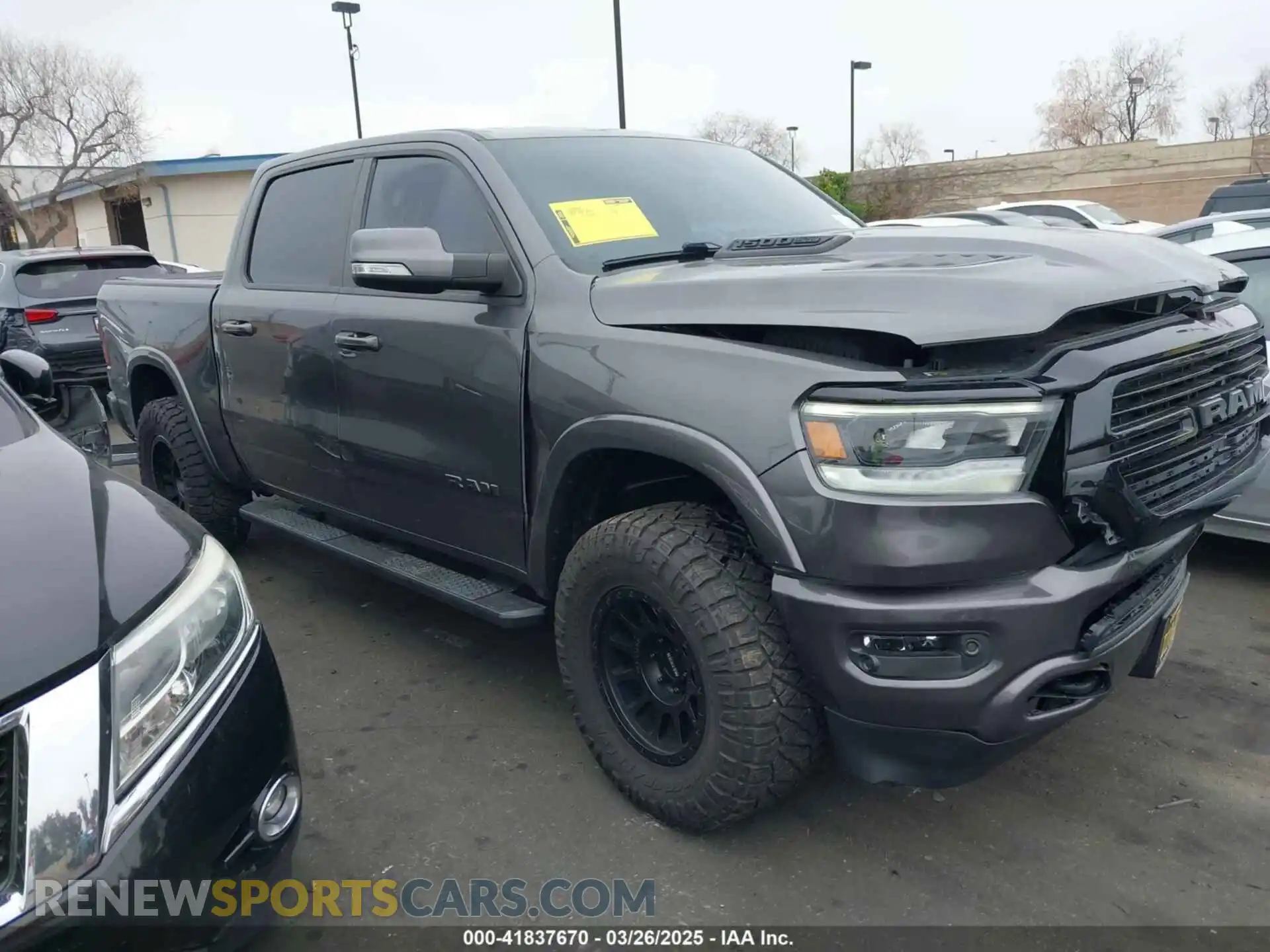 1 Photograph of a damaged car 1C6SRFJTXLN323075 RAM 1500 2020