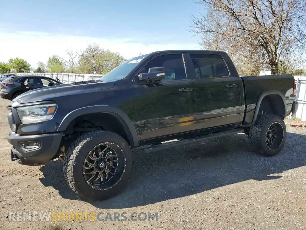 1 Photograph of a damaged car 1C6SRFLT0LN244883 RAM 1500 2020