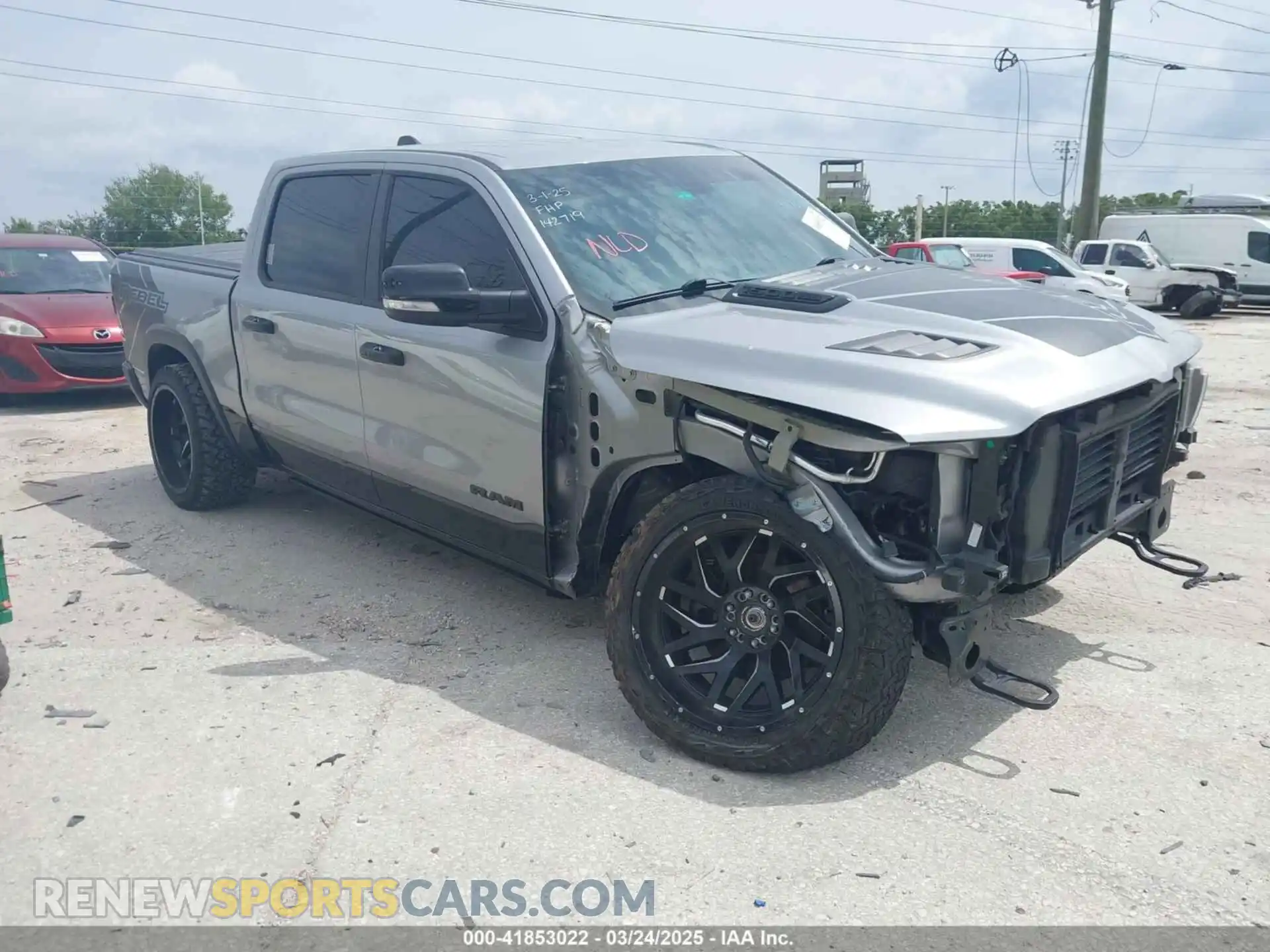 1 Photograph of a damaged car 1C6SRFLT3LN142719 RAM 1500 2020