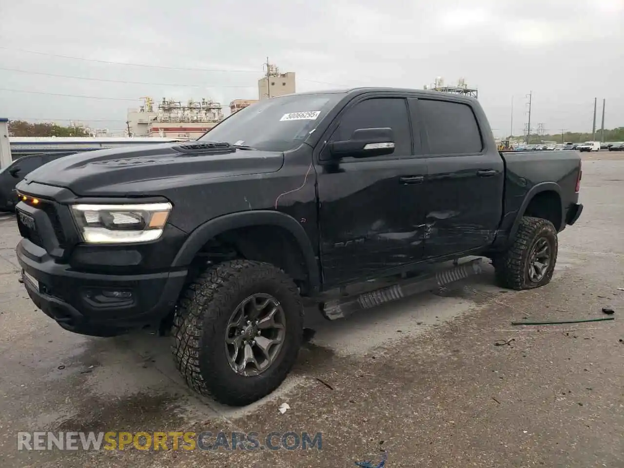 1 Photograph of a damaged car 1C6SRFLT5LN402232 RAM 1500 2020