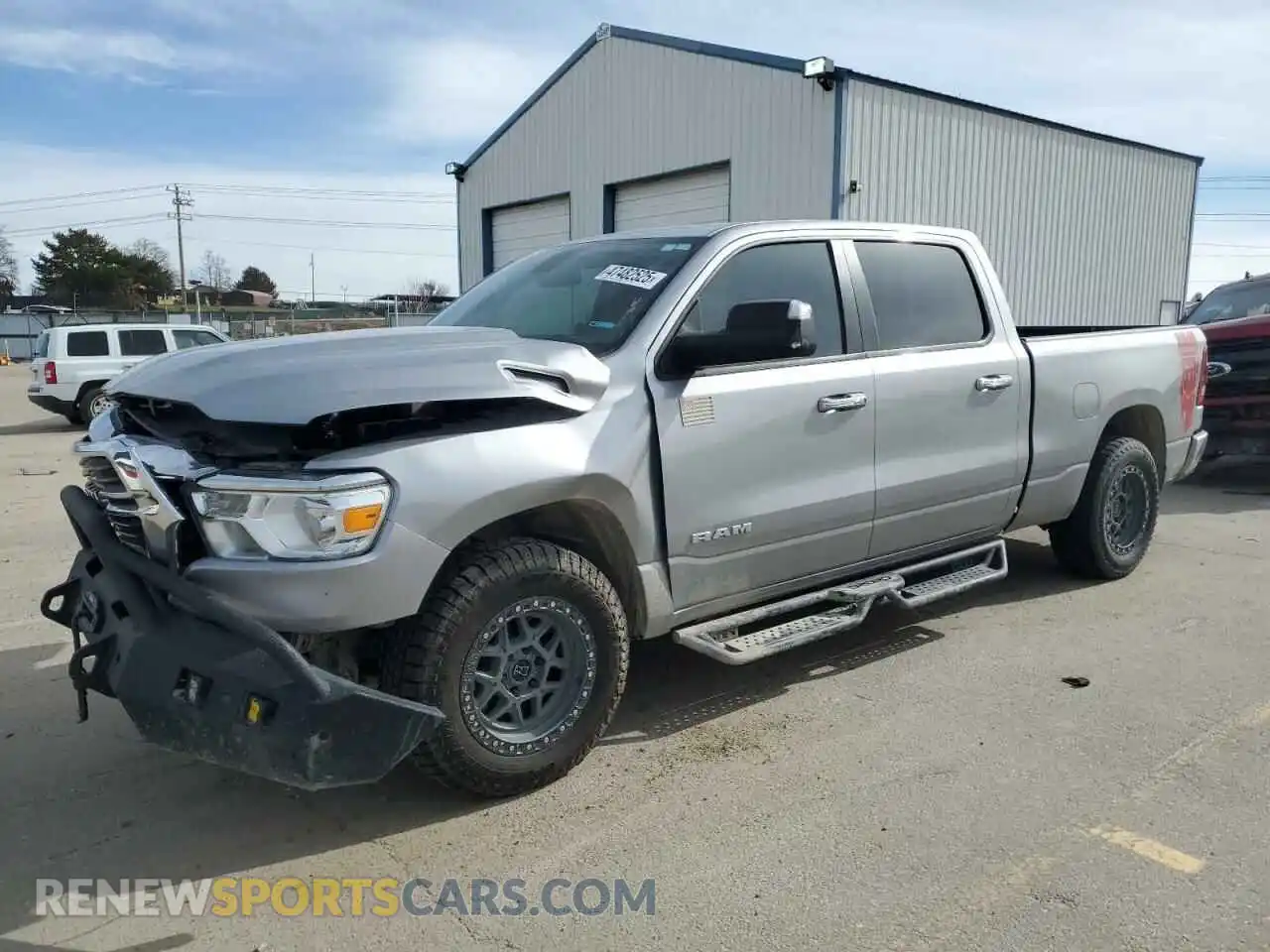 1 Photograph of a damaged car 1C6SRFMT6LN386718 RAM 1500 2020