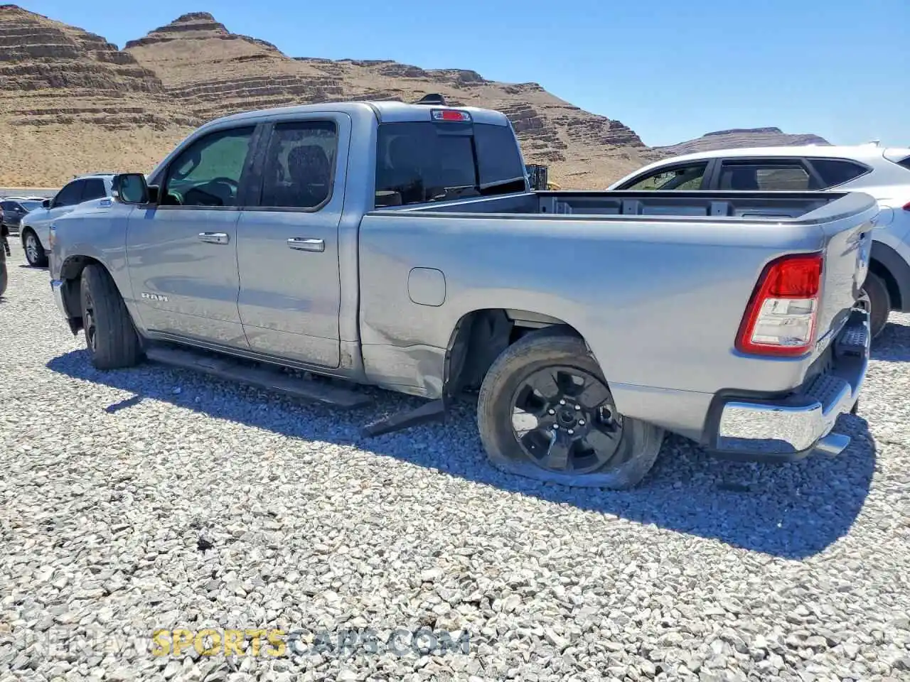 2 Photograph of a damaged car 1C6RREBT0MN545228 RAM 1500 2021