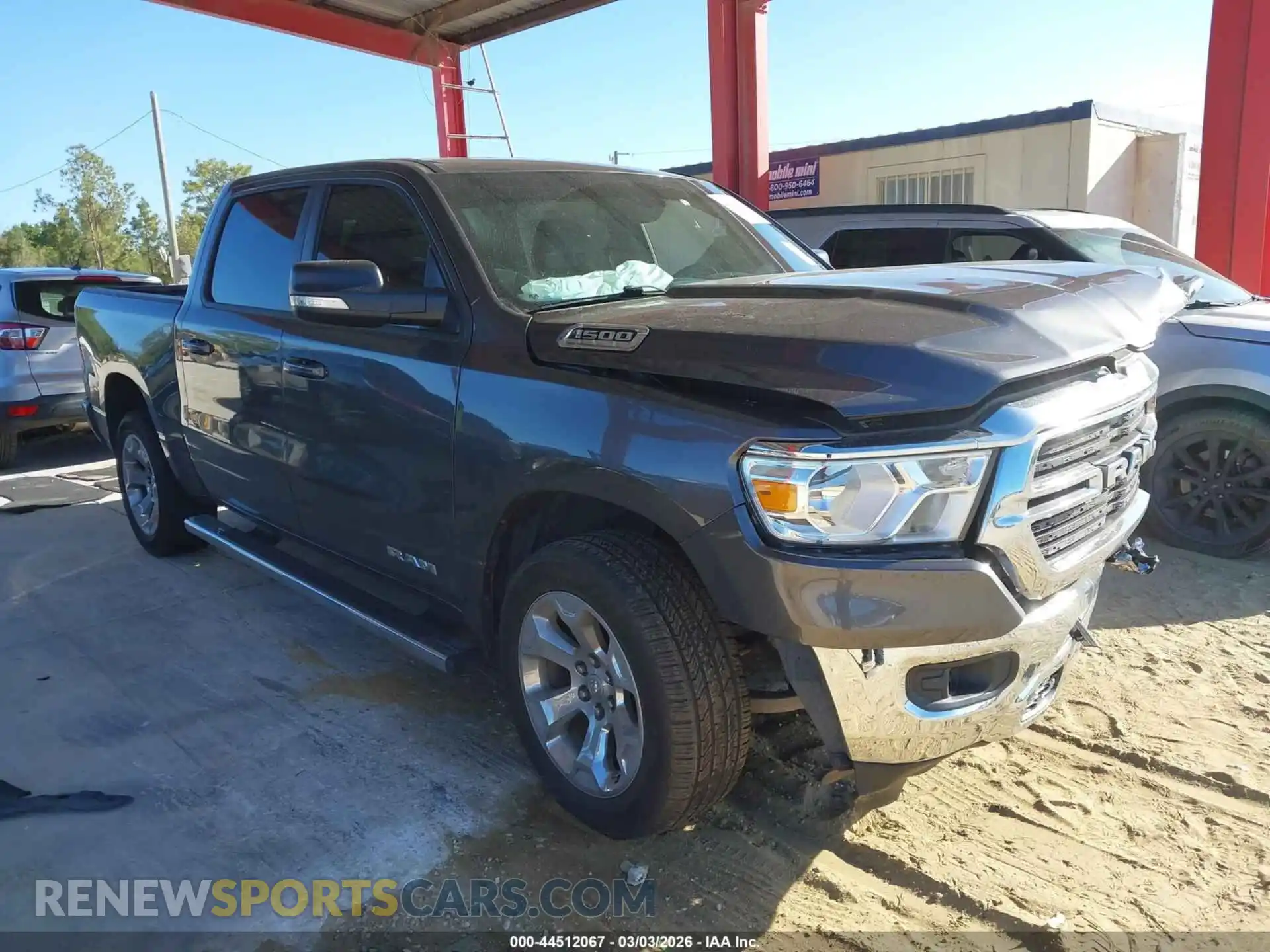 1 Photograph of a damaged car 1C6RREFG2MN532980 RAM 1500 2021