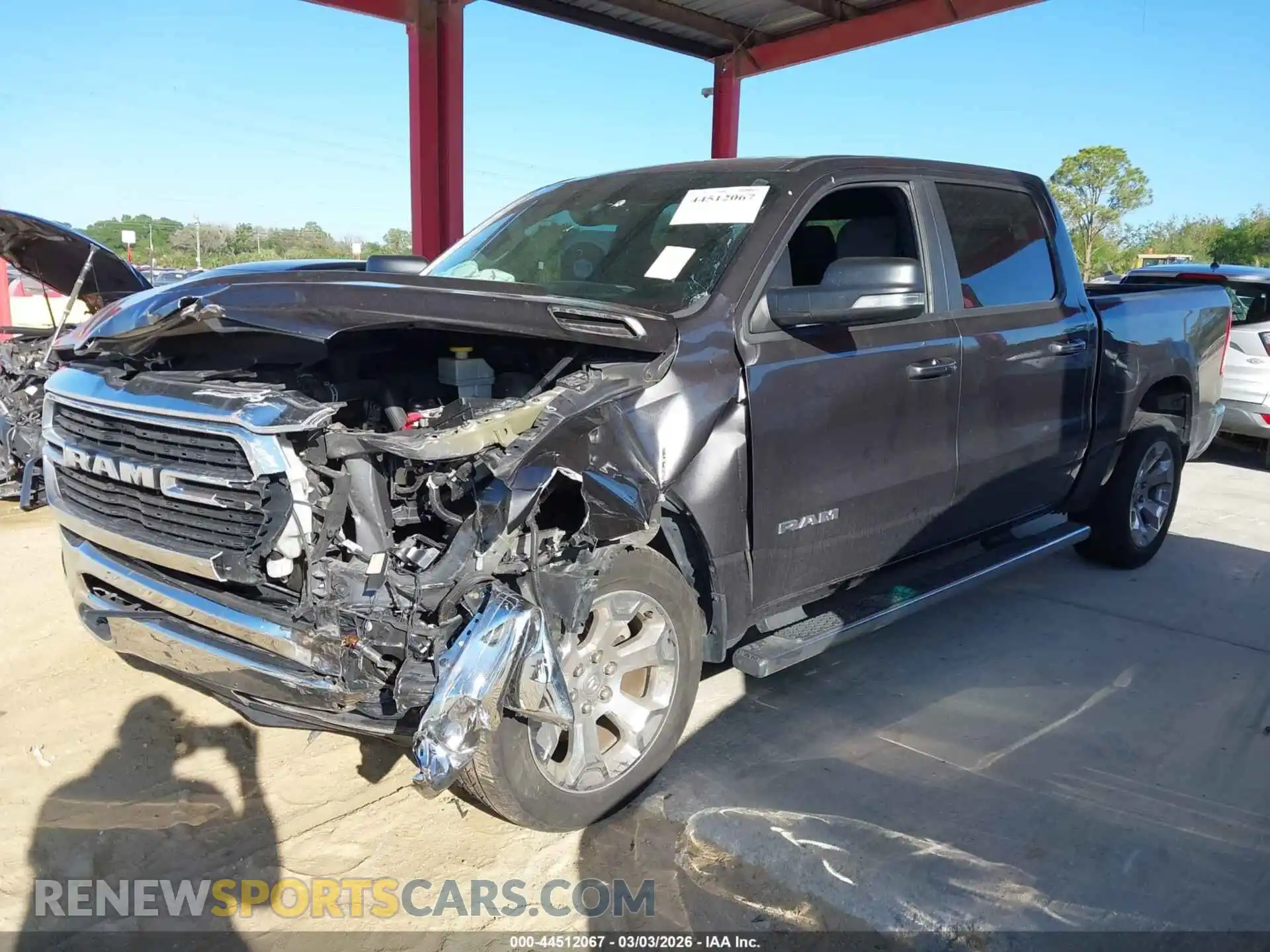 2 Photograph of a damaged car 1C6RREFG2MN532980 RAM 1500 2021