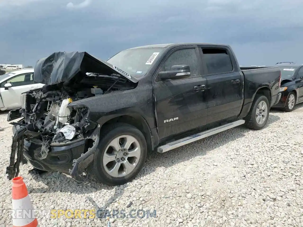 1 Photograph of a damaged car 1C6RREFG3MN768120 RAM 1500 2021