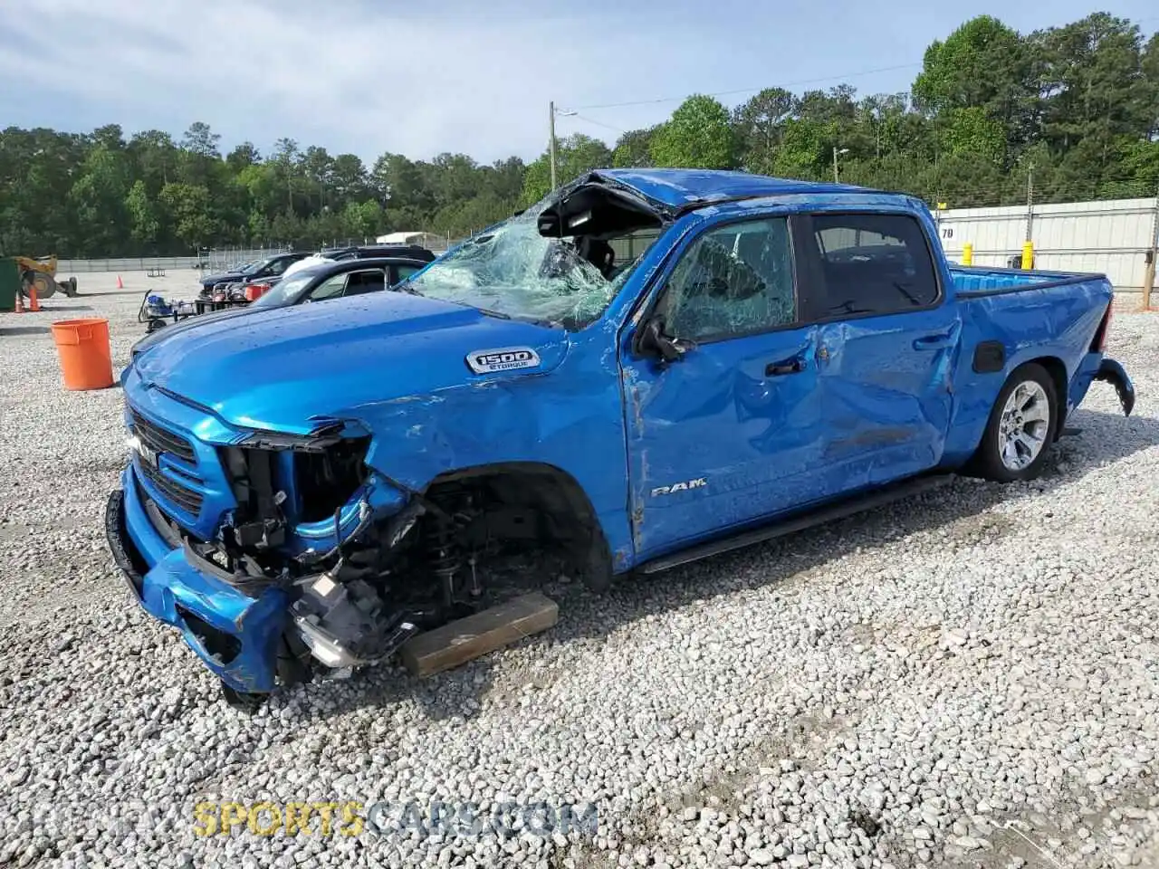 1 Photograph of a damaged car 1C6RREFG4MN801965 RAM 1500 2021