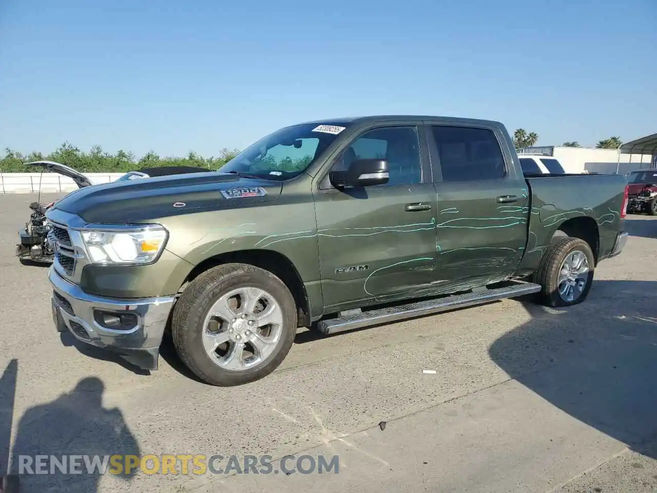 1 Photograph of a damaged car 1C6RREFM8MN630286 RAM 1500 2021