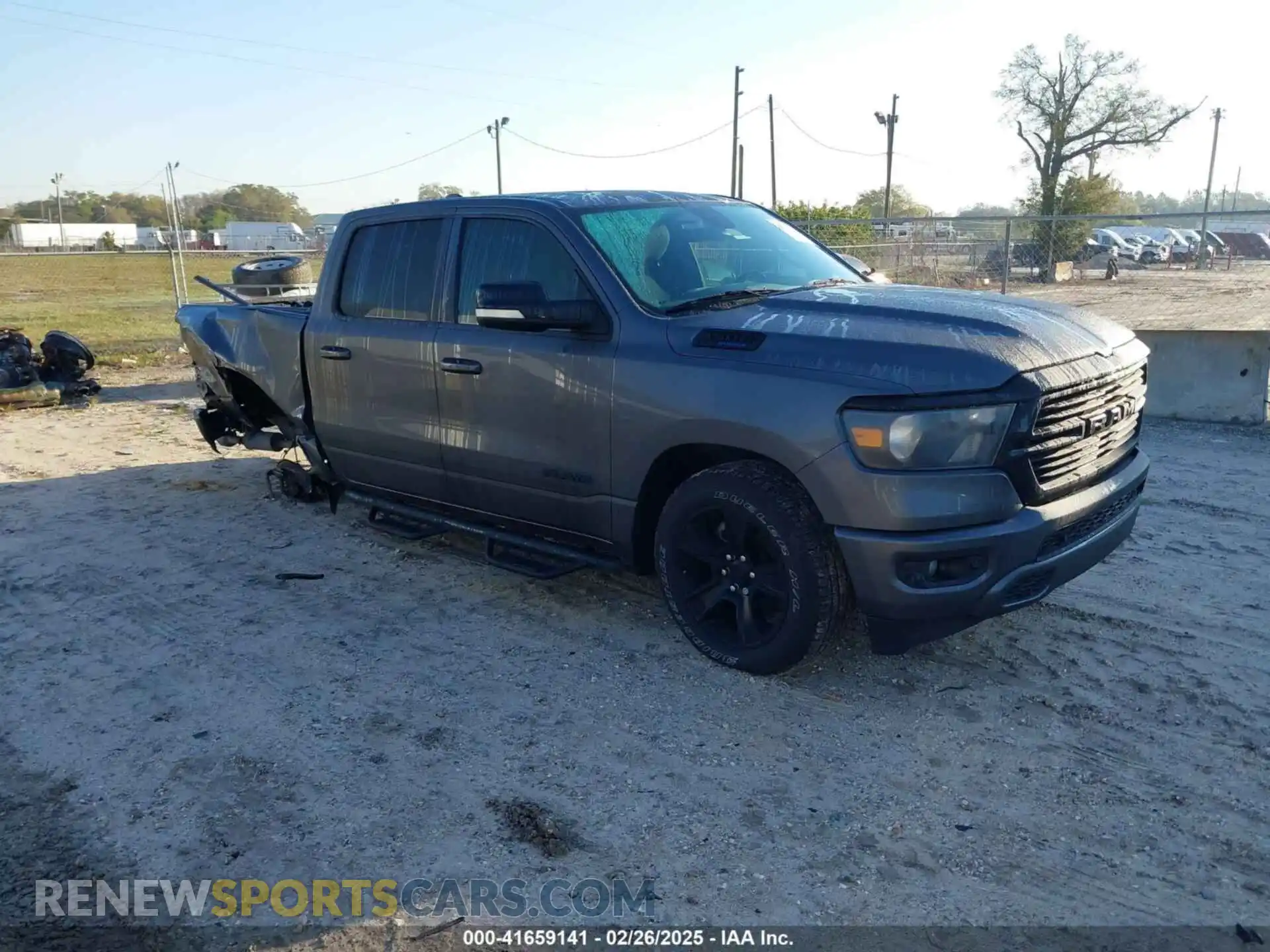 1 Photograph of a damaged car 1C6RREFT0MN629169 RAM 1500 2021