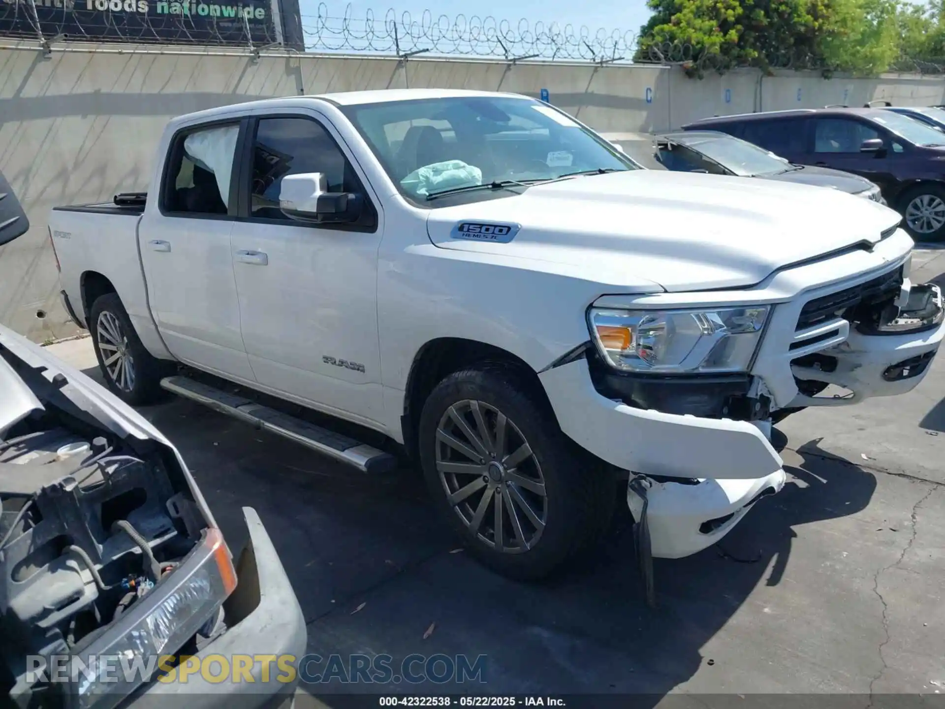 1 Photograph of a damaged car 1C6RREFT1MN608699 RAM 1500 2021