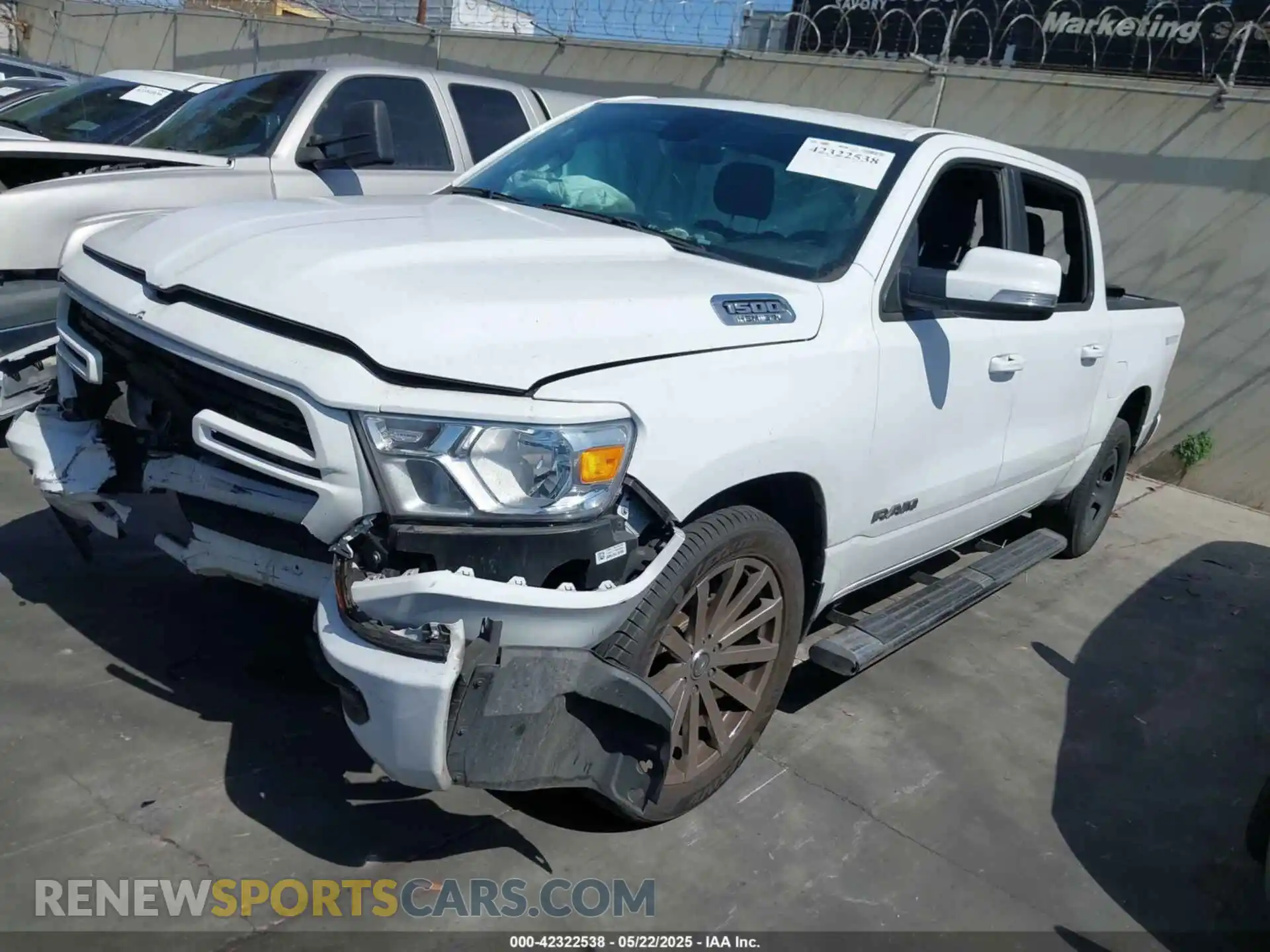 2 Photograph of a damaged car 1C6RREFT1MN608699 RAM 1500 2021
