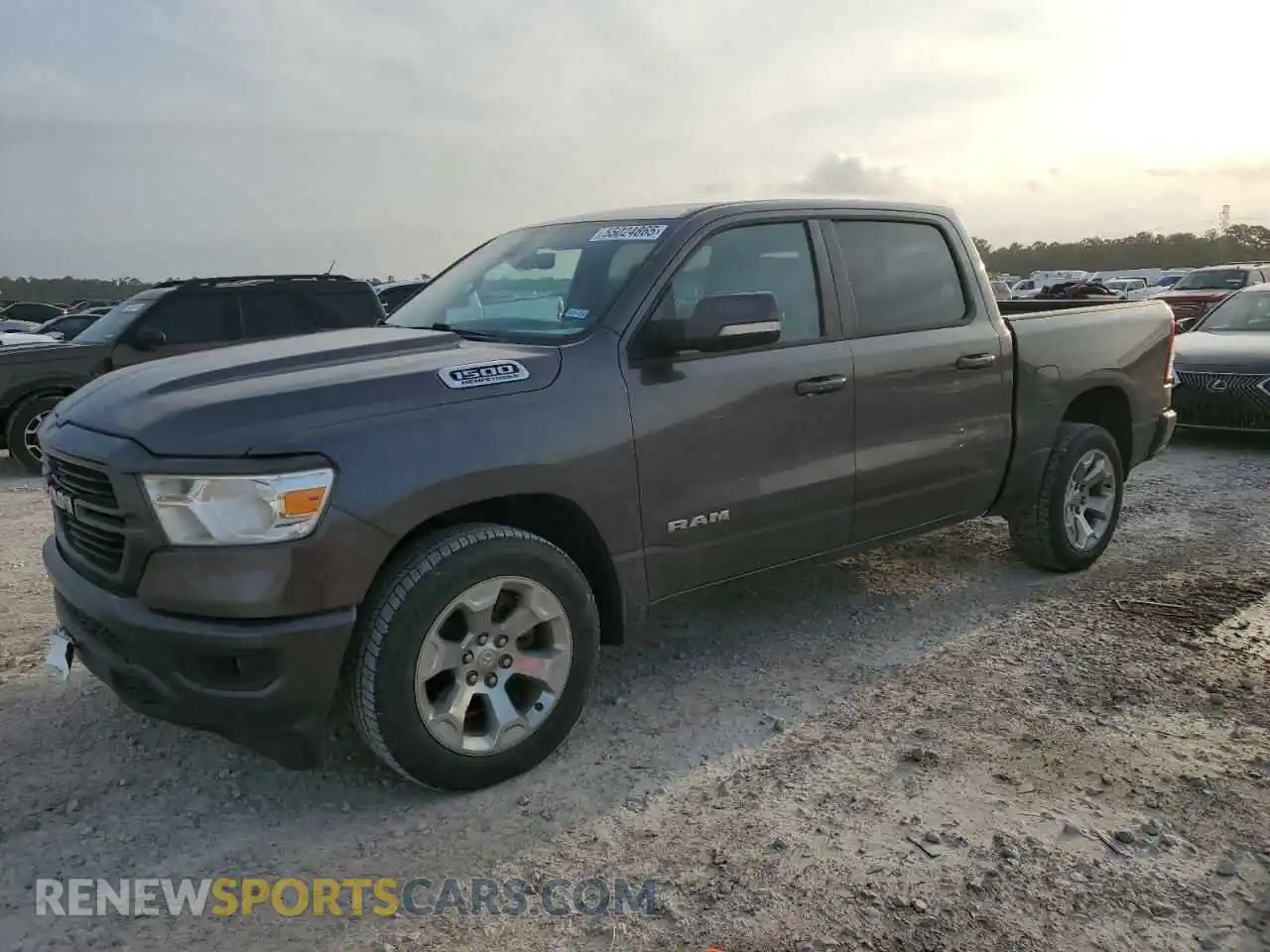 1 Photograph of a damaged car 1C6RREFT1MN630881 RAM 1500 2021