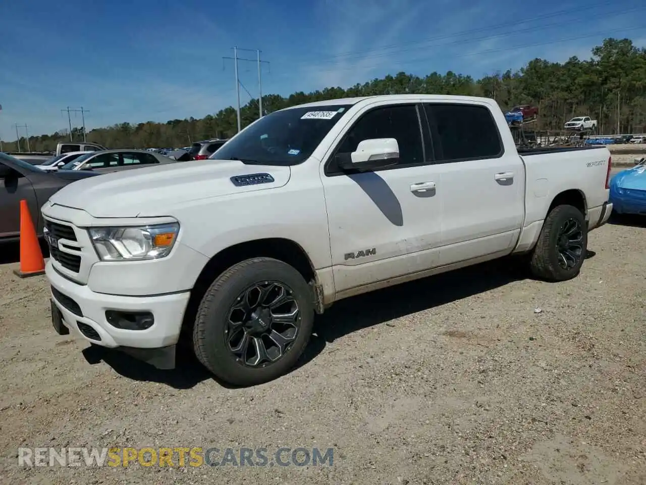 1 Photograph of a damaged car 1C6RREFT1MN653979 RAM 1500 2021