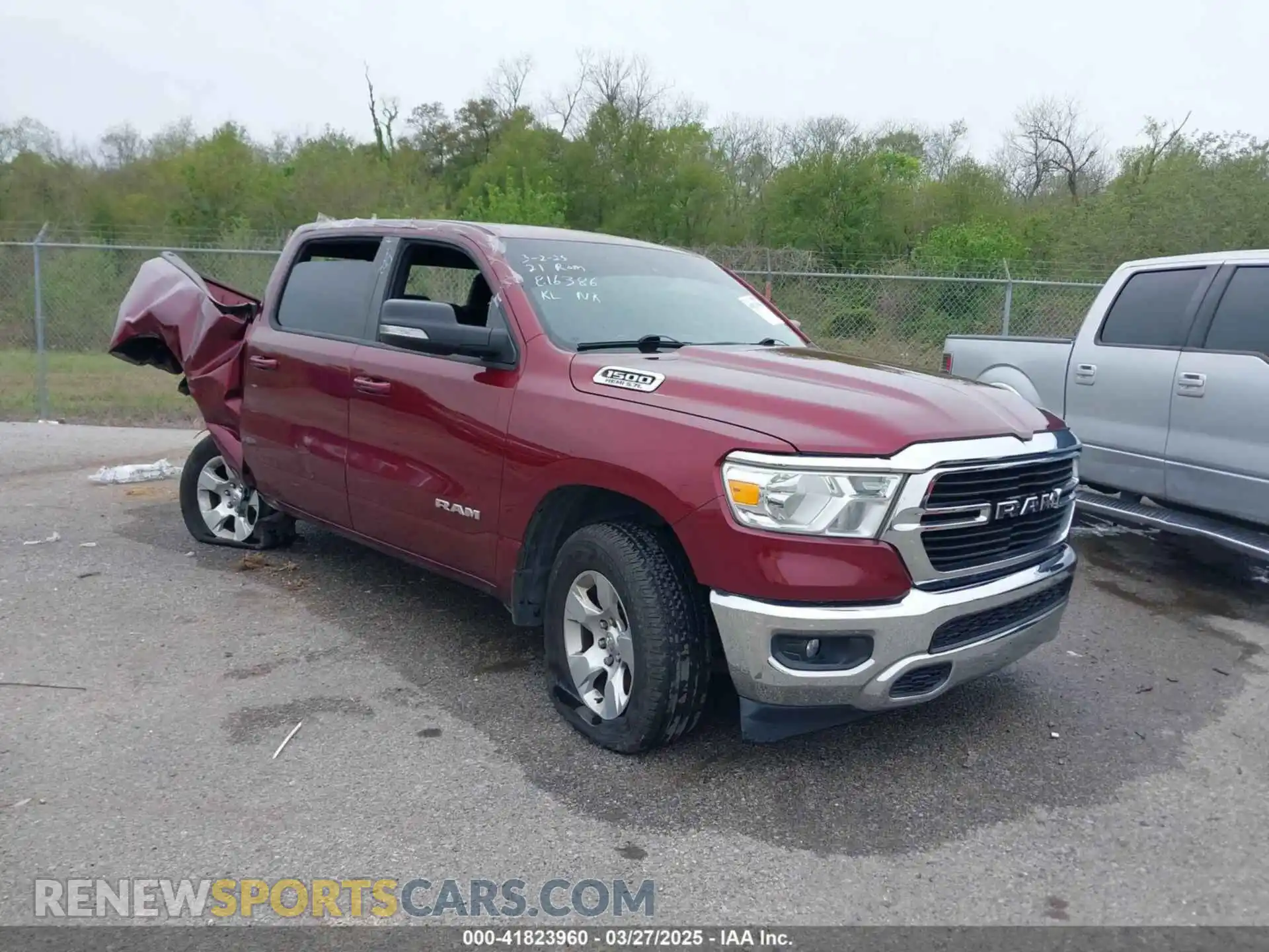 1 Photograph of a damaged car 1C6RREFT1MN816386 RAM 1500 2021