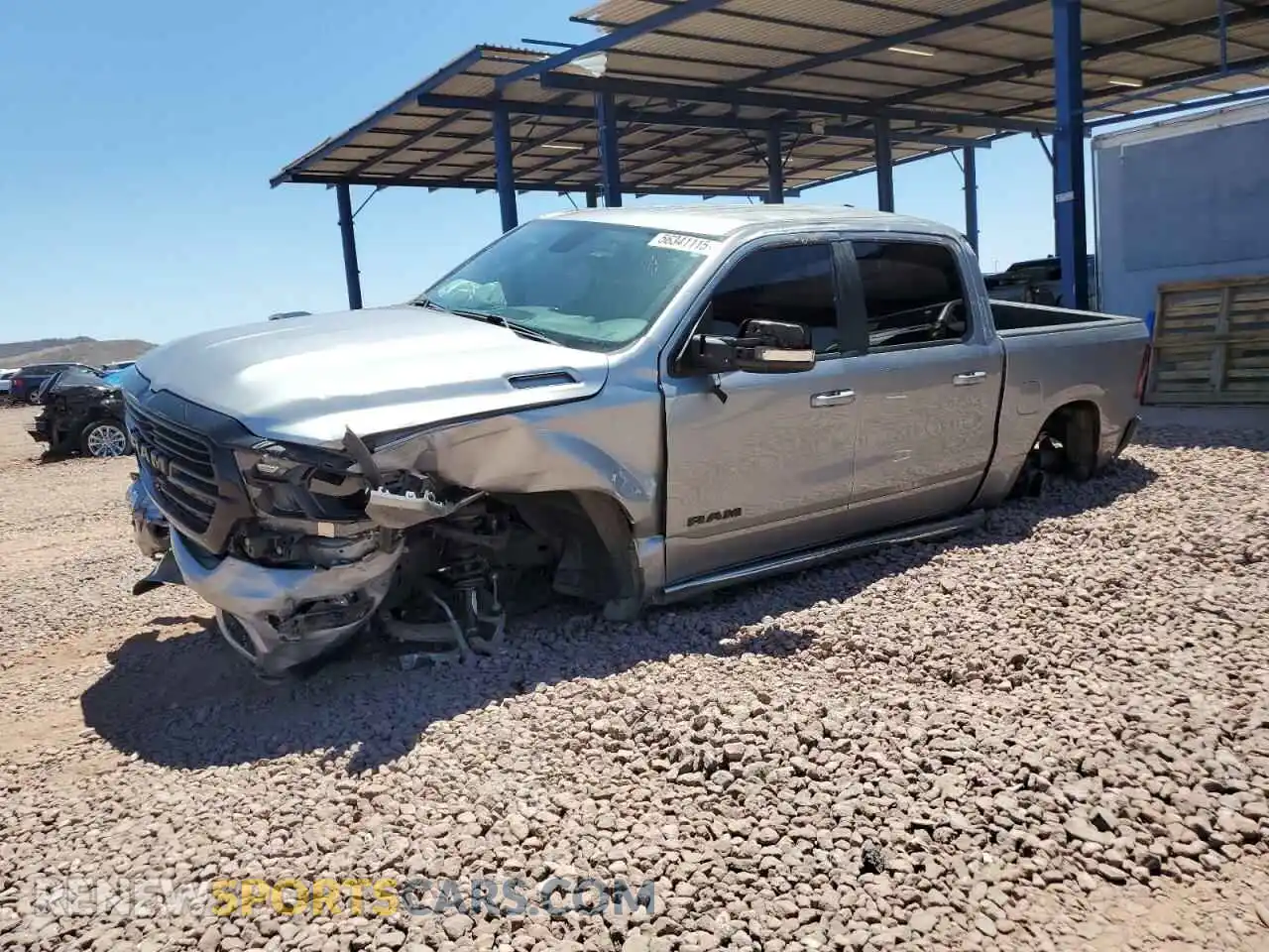 1 Photograph of a damaged car 1C6RREFT2MN590066 RAM 1500 2021