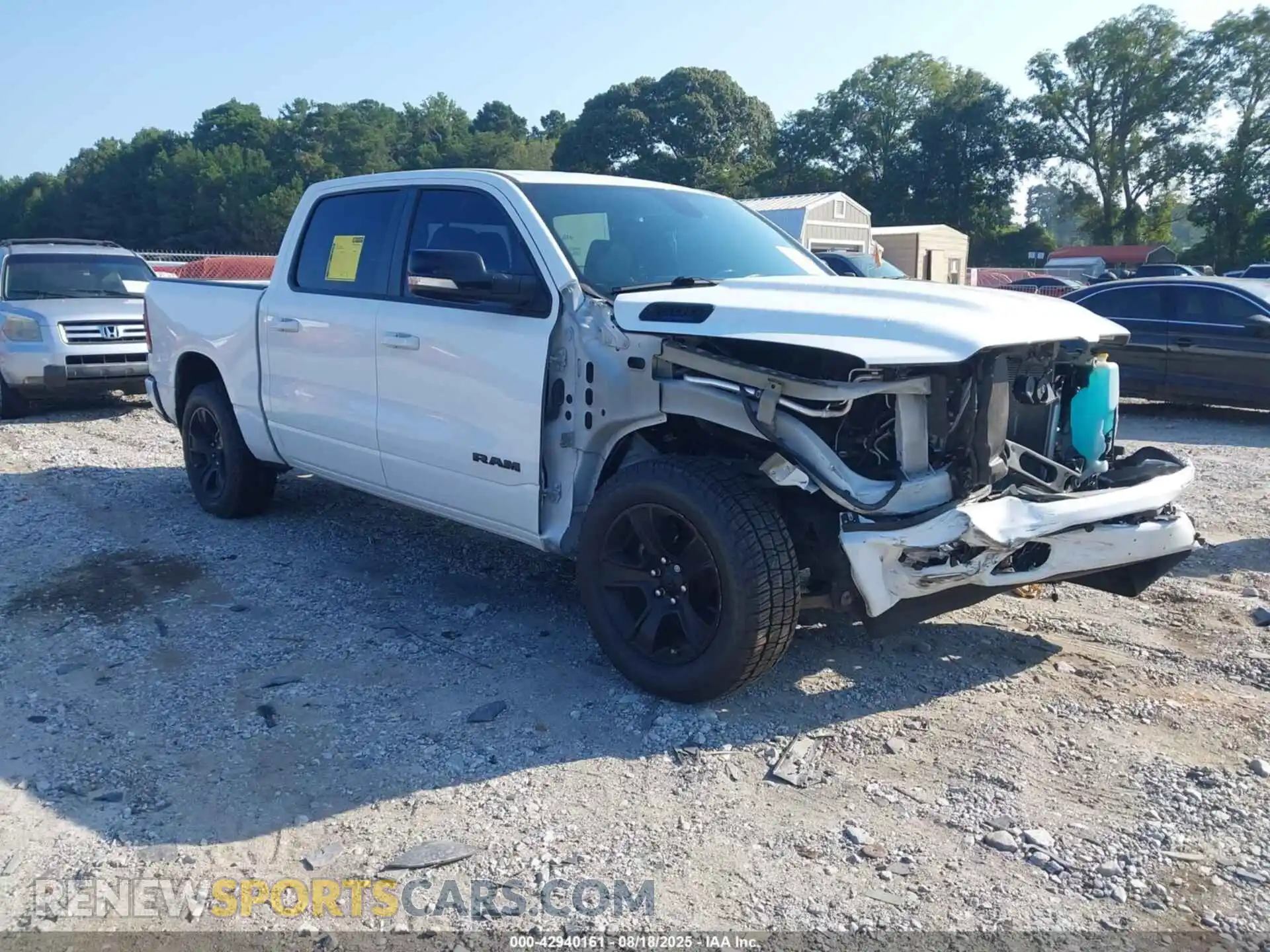 1 Photograph of a damaged car 1C6RREFT3MN629070 RAM 1500 2021