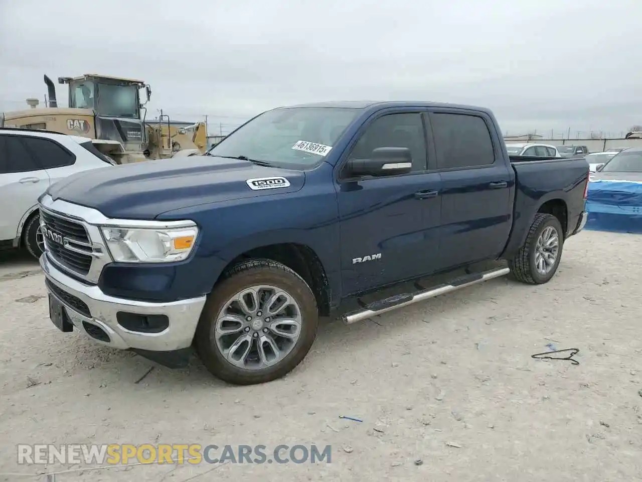 1 Photograph of a damaged car 1C6RREFT3MN631465 RAM 1500 2021