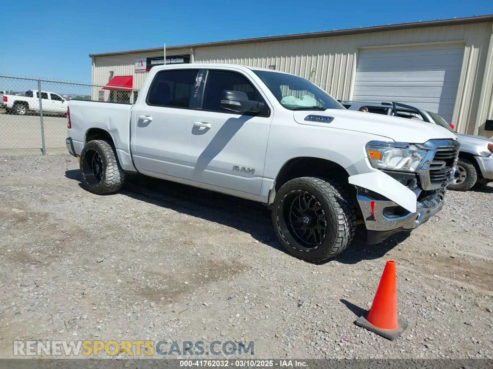 1 Photograph of a damaged car 1C6RREFT4MN708750 RAM 1500 2021