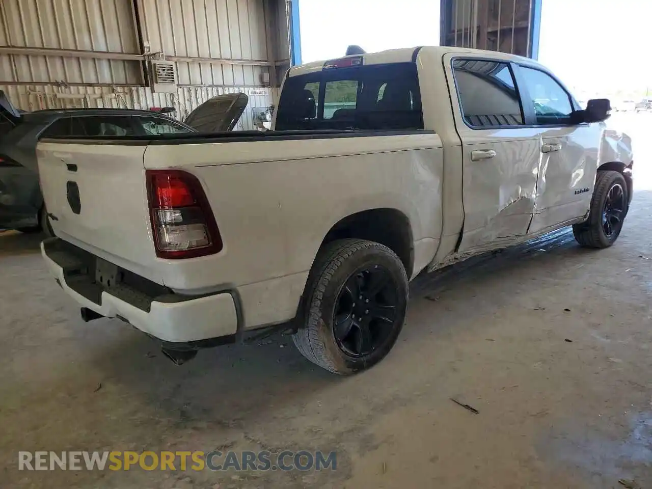 3 Photograph of a damaged car 1C6RREFT5MN709910 RAM 1500 2021