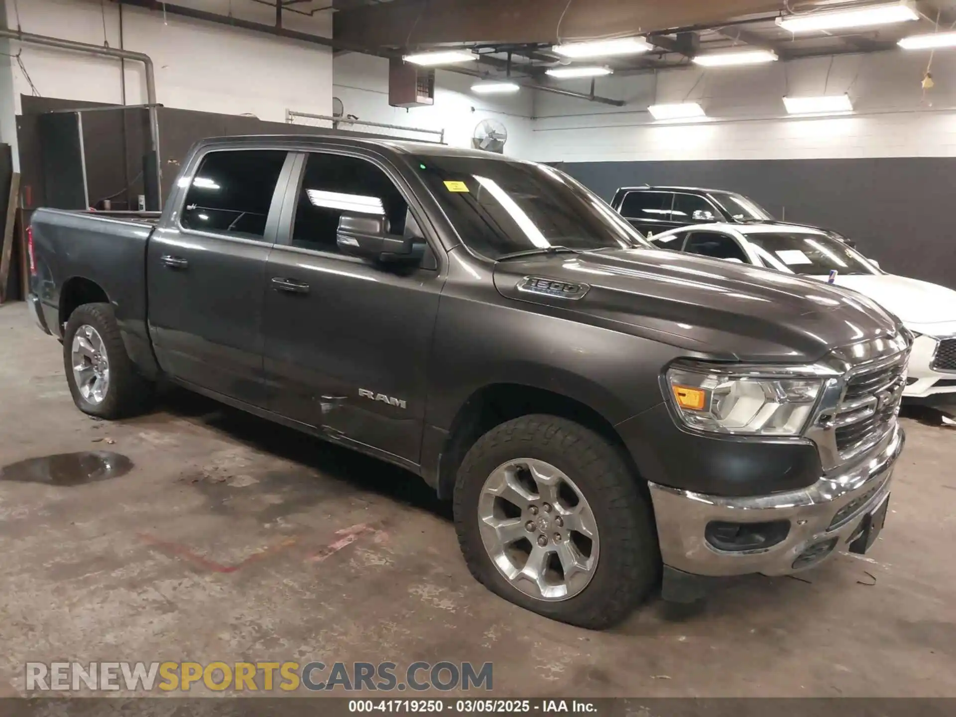 1 Photograph of a damaged car 1C6RRFFG6MN621716 RAM 1500 2021